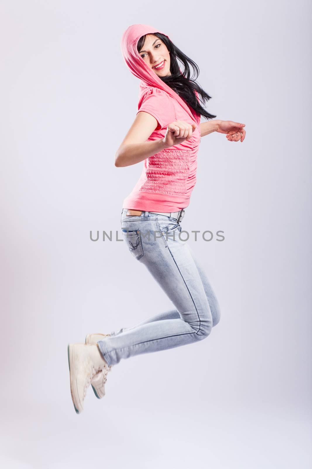 attractive young girl jumping by kokimk