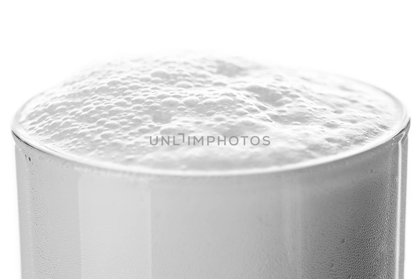 abstract beer glass with beer foam and bubbles