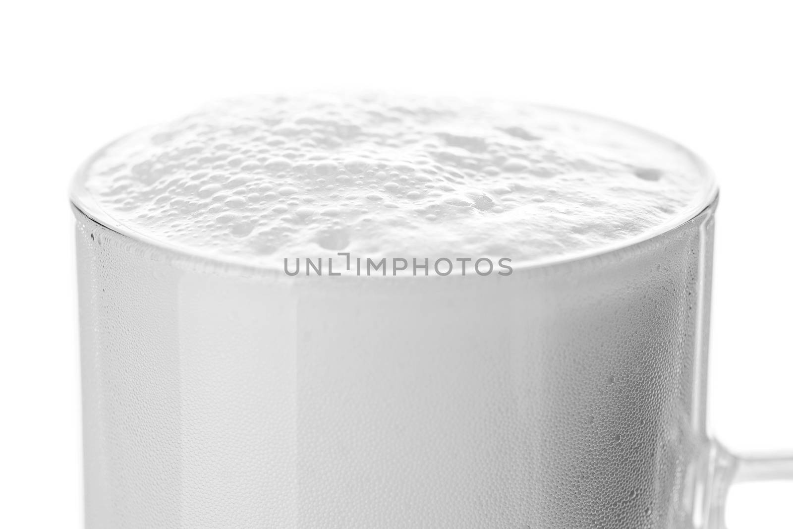 abstract beer glass with beer foam and bubbles