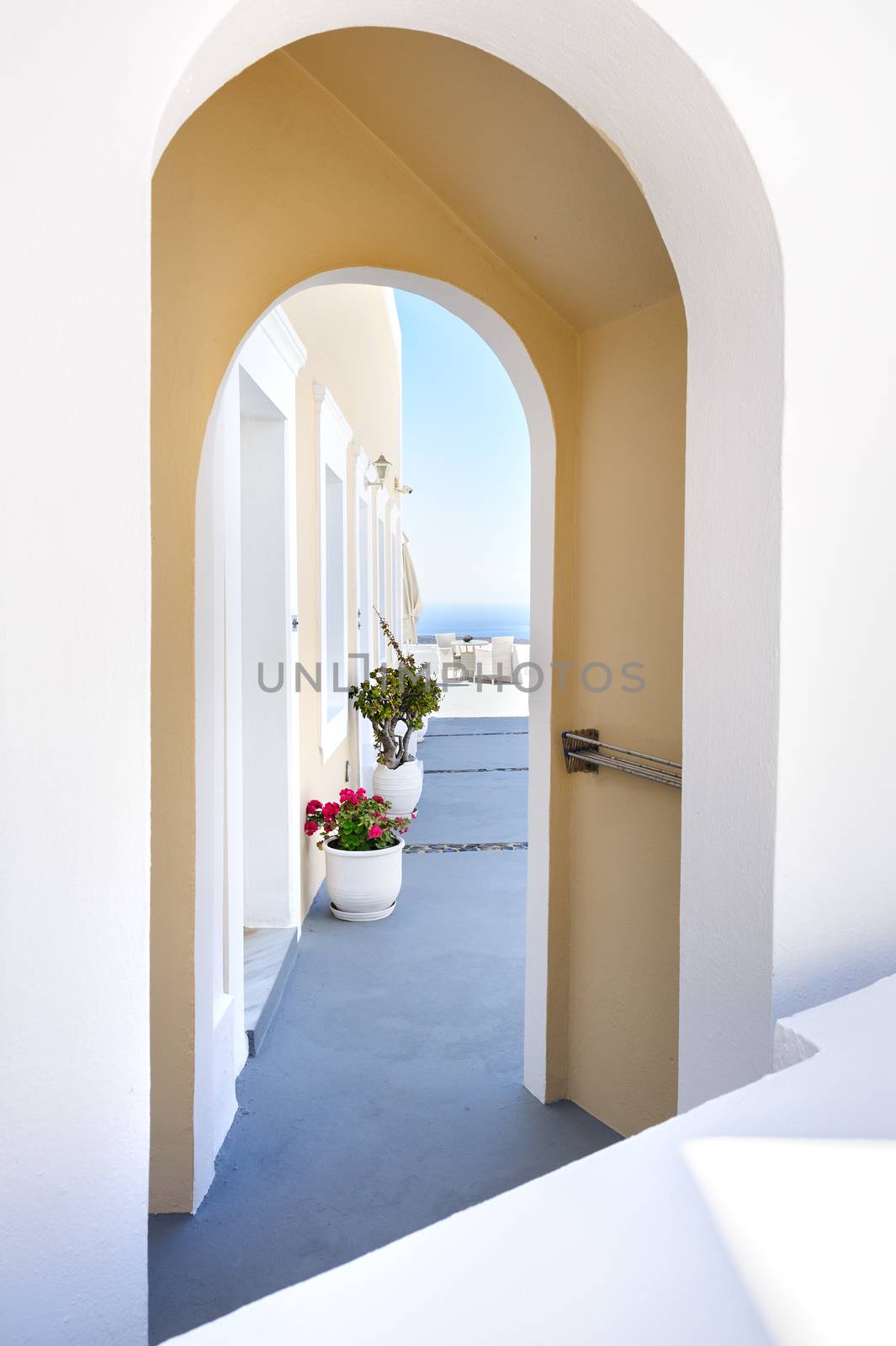 Arch at luxury decks and patios of Oia, Santorini, Greece