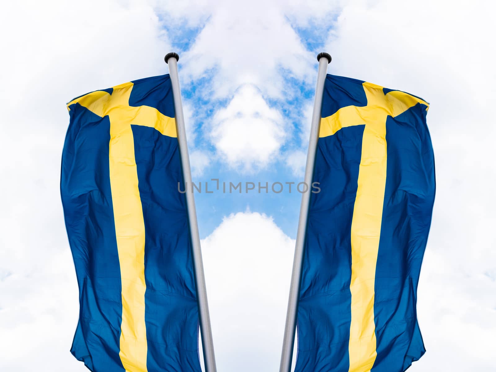 Swedish country flag arranged against a blue sky.