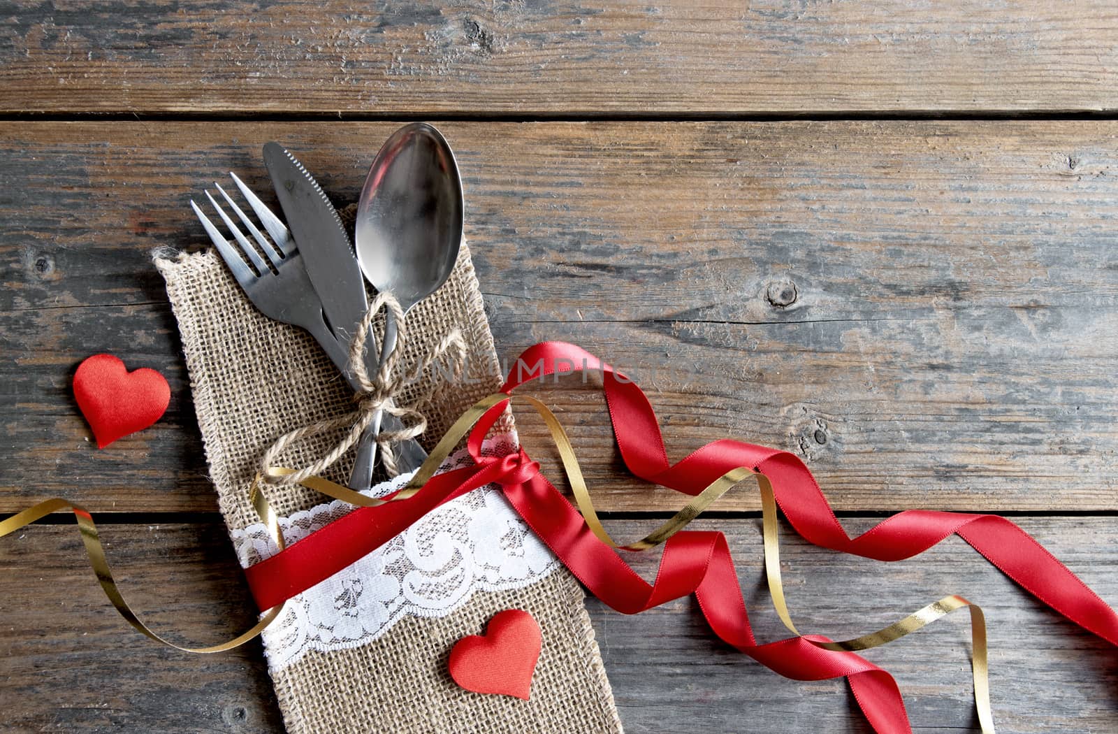 Cutlery set inside pouch with silk ribbon and space for text 