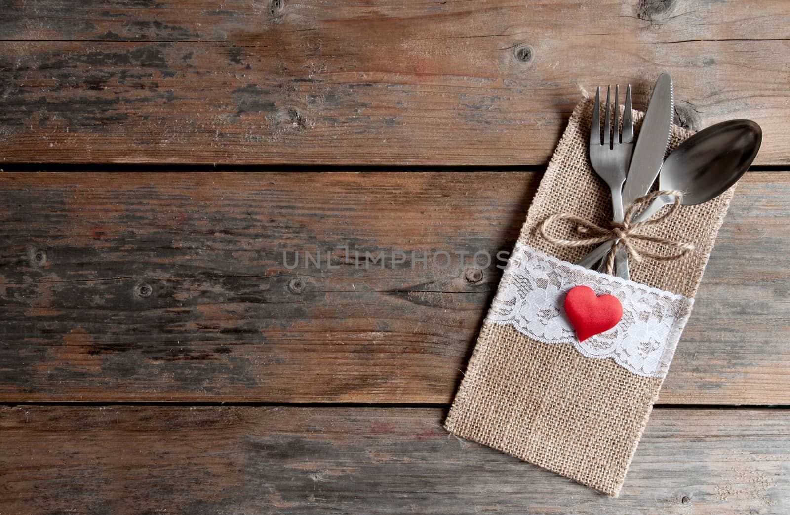 Cutlery set inside pouch with heart shape and space 