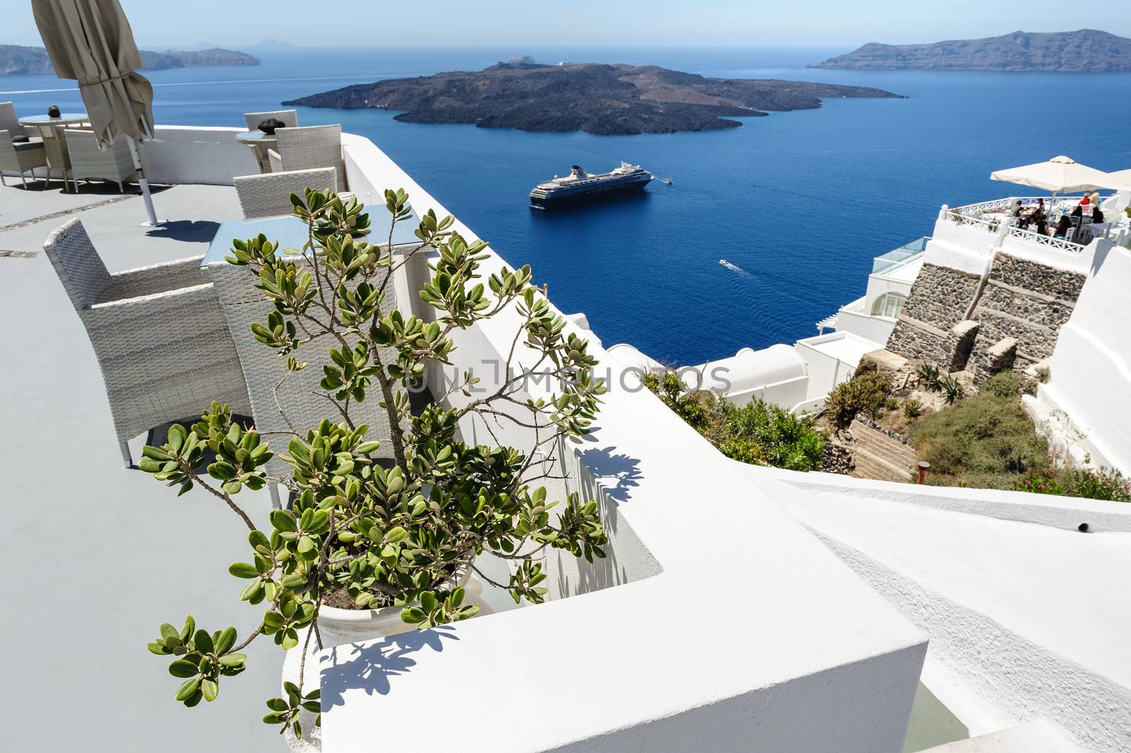 Luxury decks and patios of Oia, Santorini, Greece, selective focus atplant