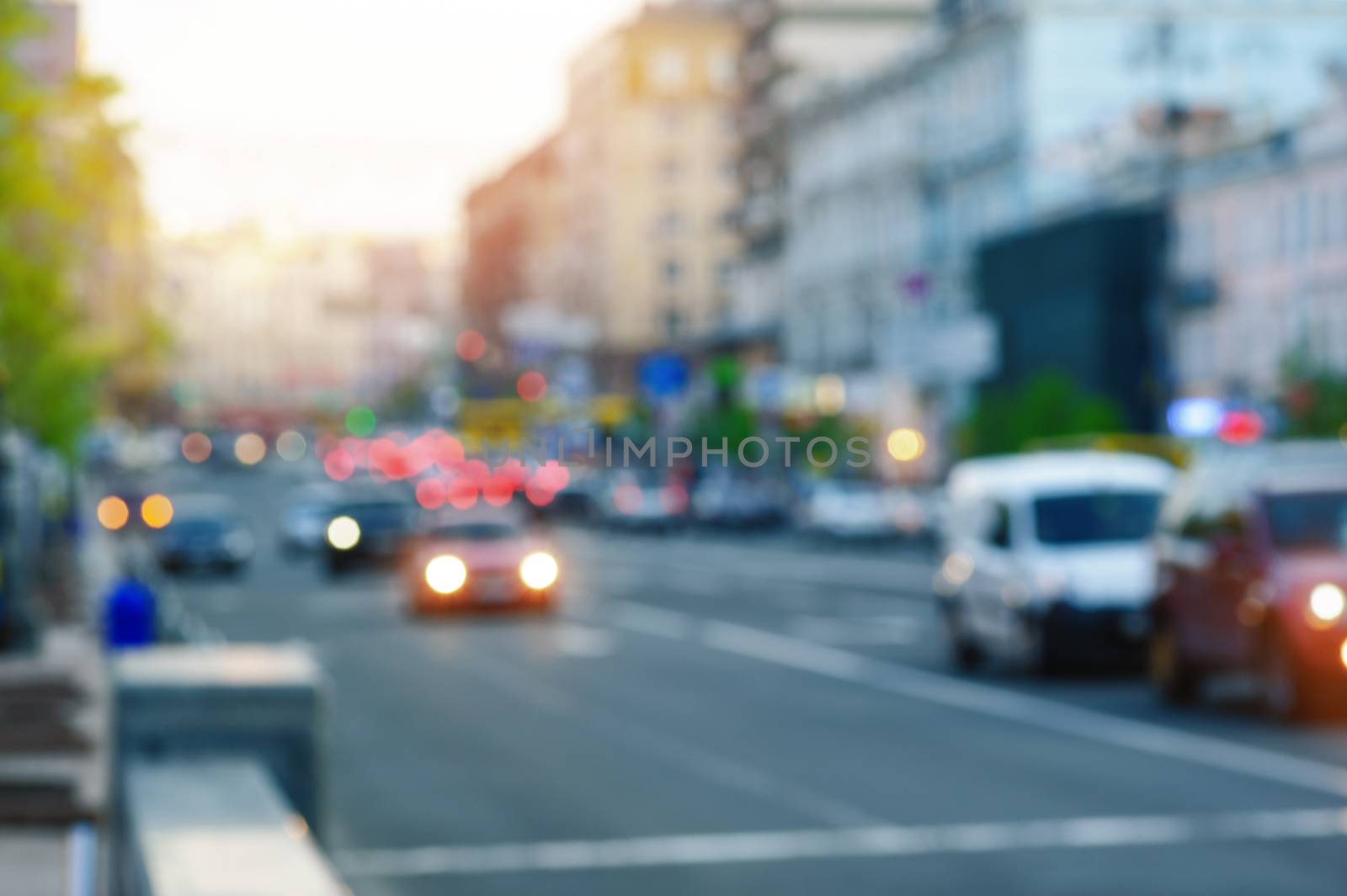 cars on the street with lights on blurred focus.