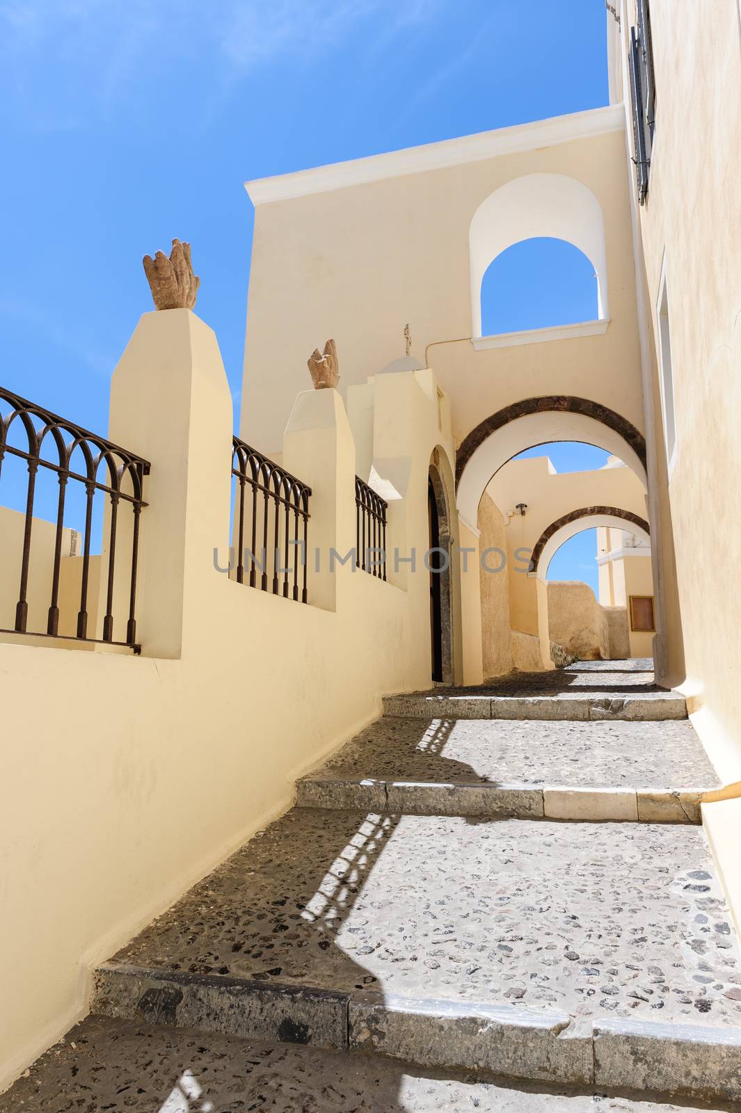 Typical narrow passage with steps in Fira, Santorini, Greece