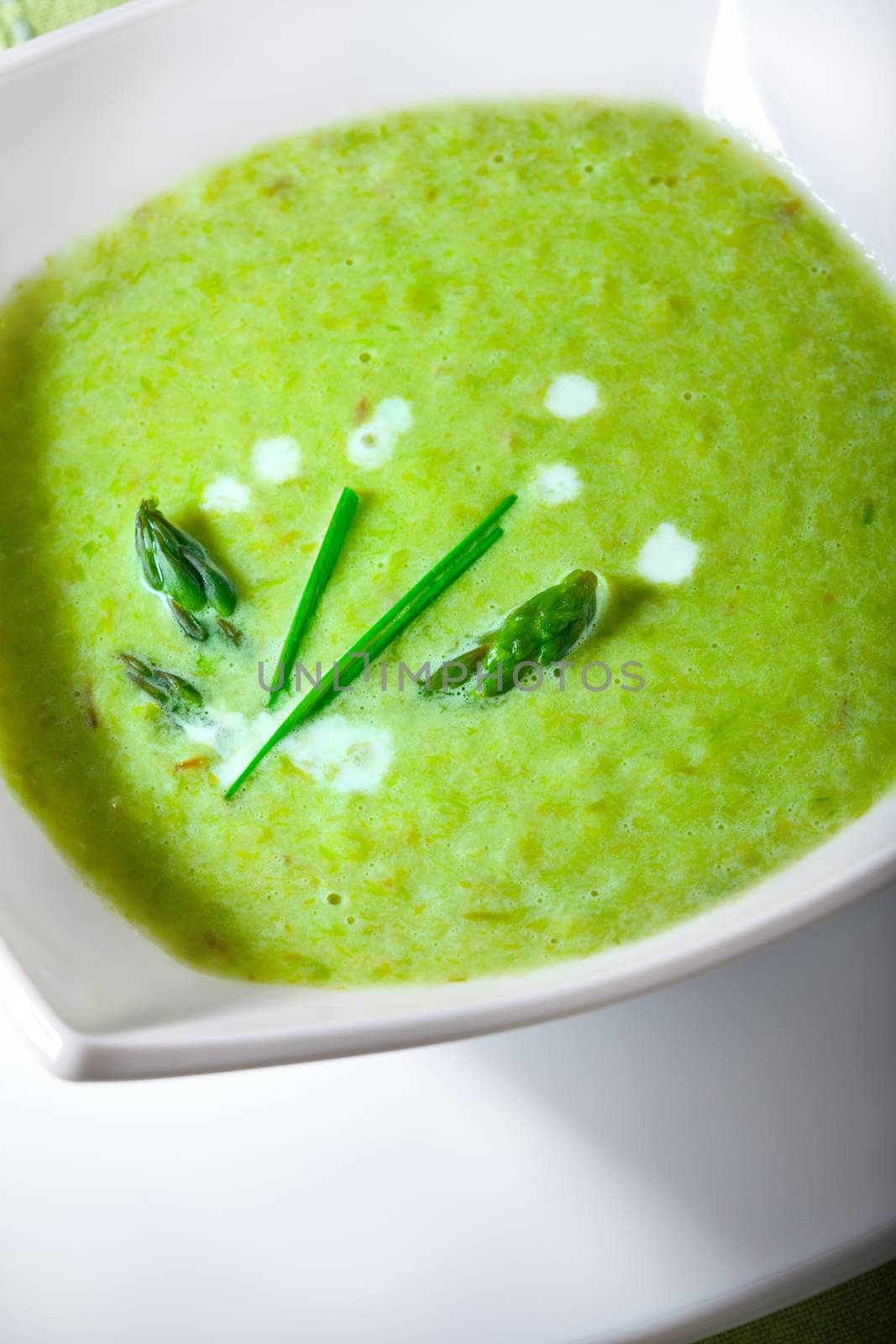 Closeup of a bowl of healthy vegetarian asparagus soup.