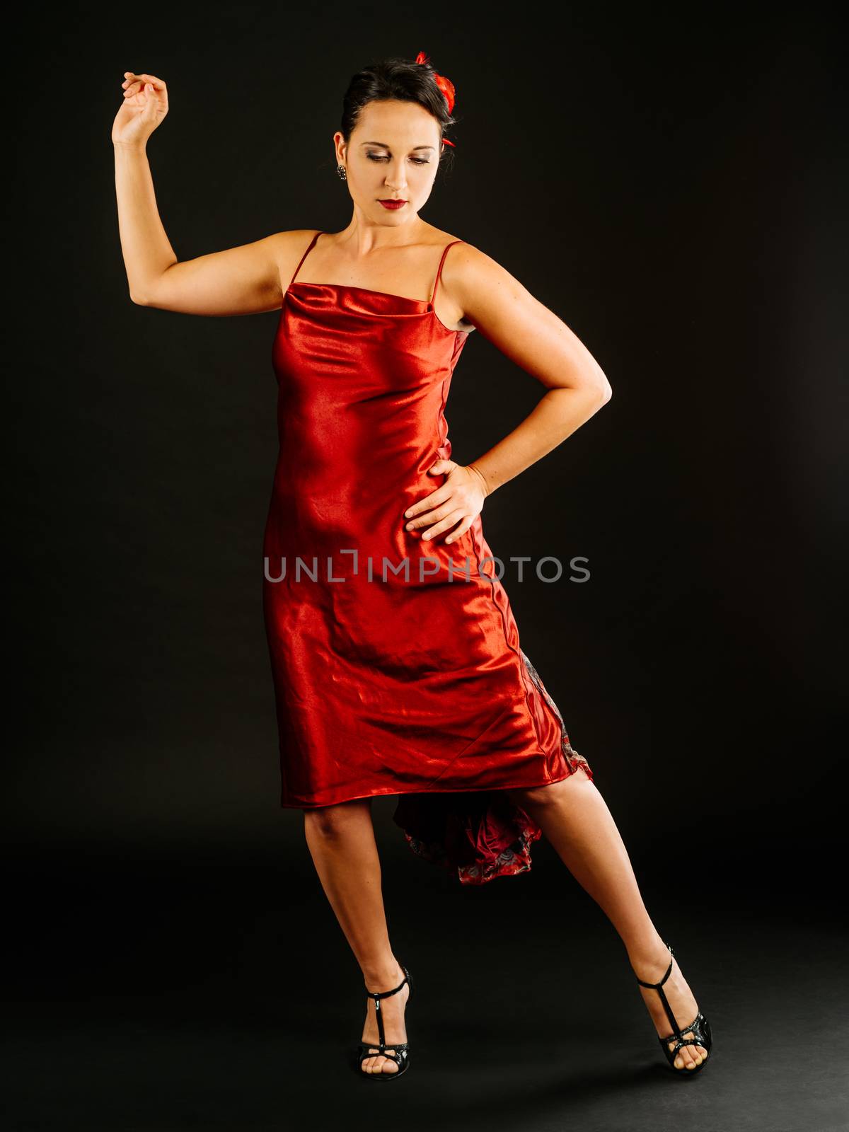 Photo of a beautiful woman performing tango dance moves.