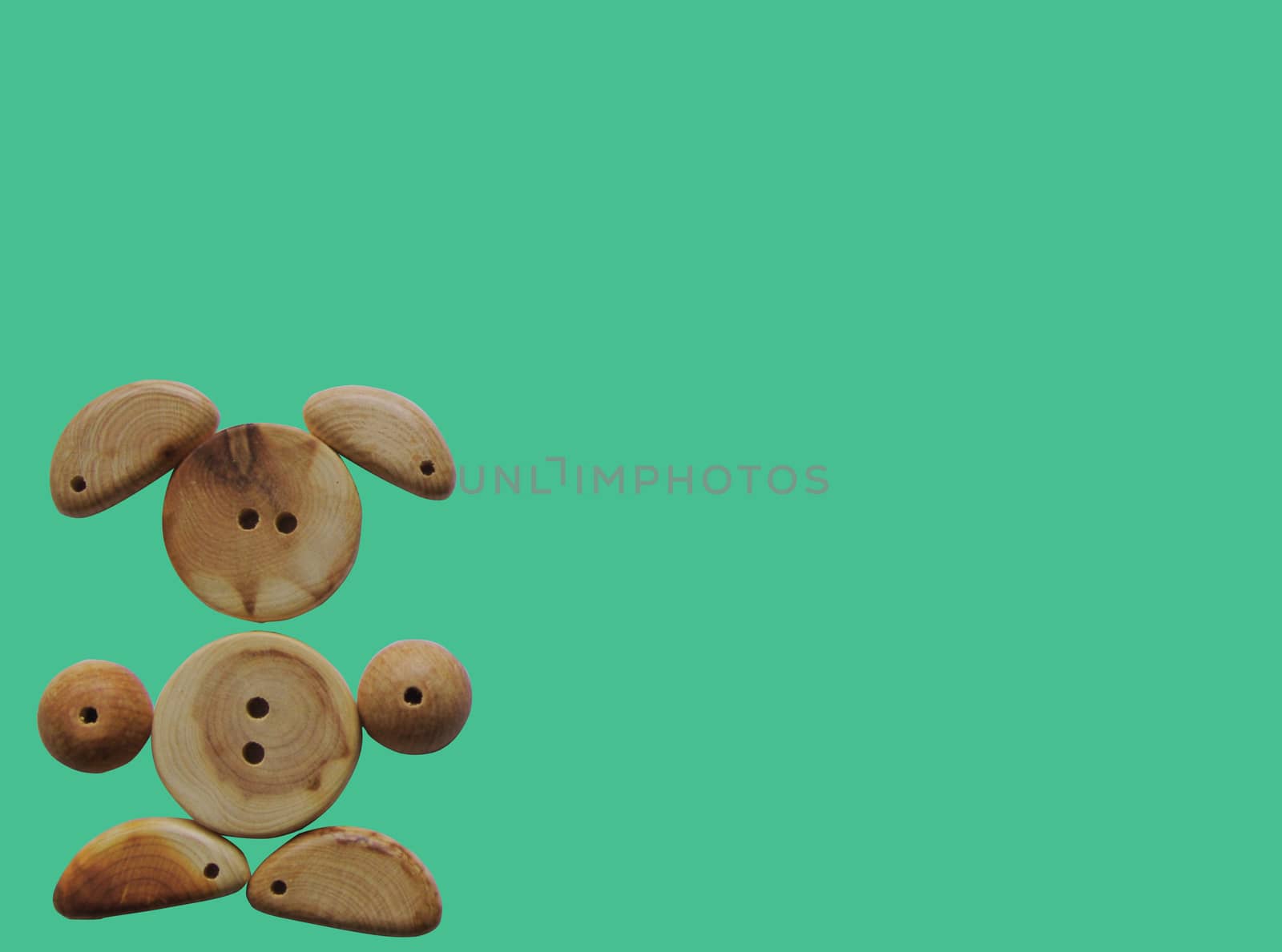 Handicraft goods,  wooden beads. Bunny. Background
