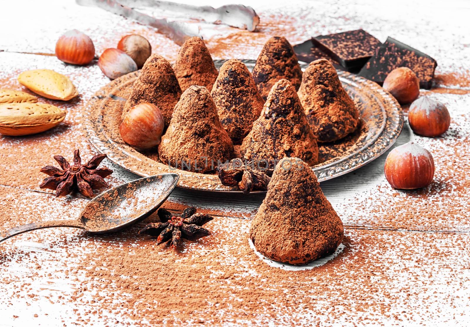 Chocolate truffles candies with cocoa powder and nuts