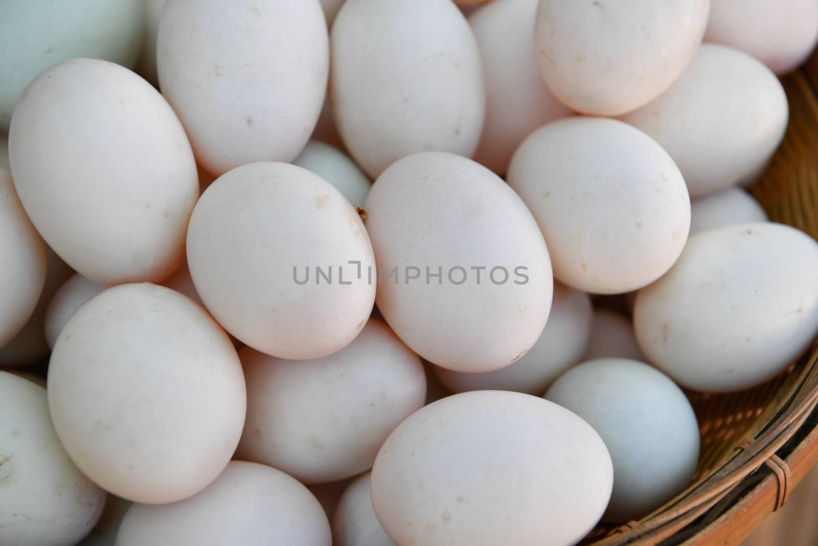 Eggs of duck in basket at market.