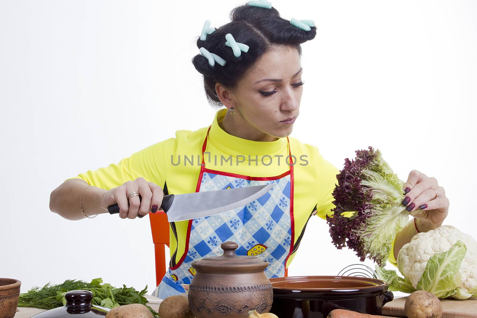 Housewife is preparing in the kitchen on a white background