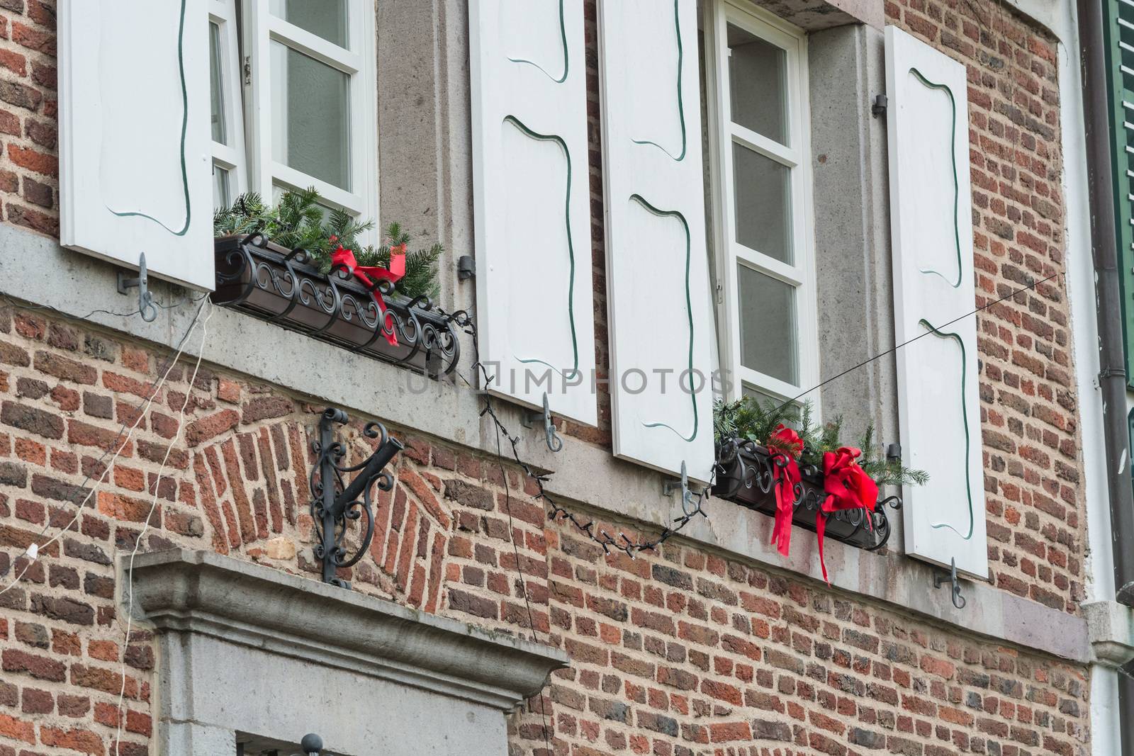 Christmas decoration of an exterior wall of a house with brickwork.