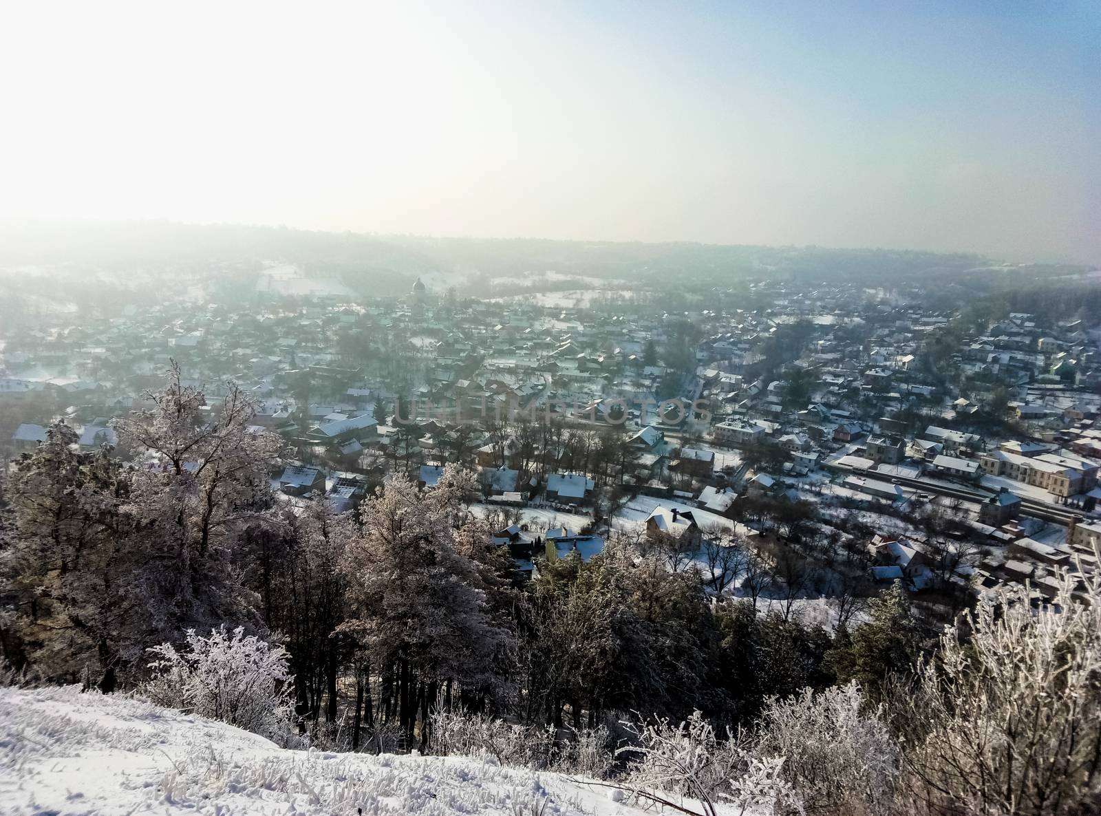 beautiful view of a winter city from atop the mountain by Oleczka11