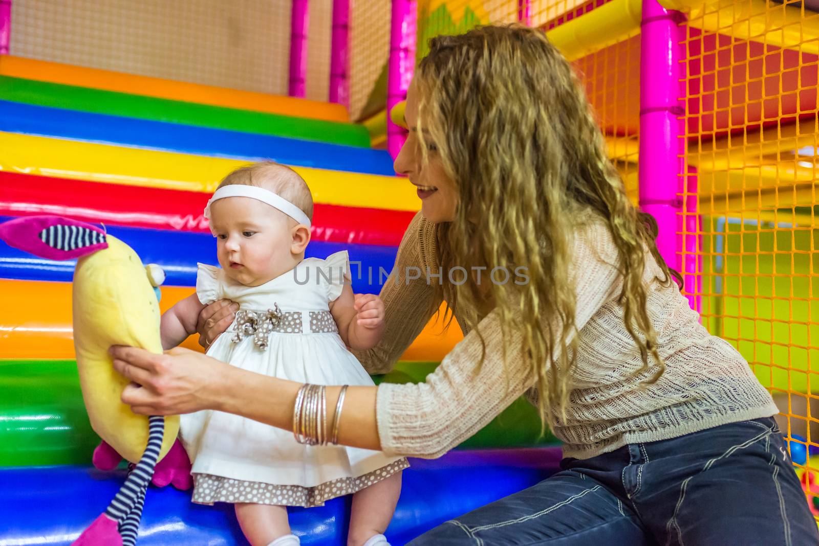 mother and child play in the children's room