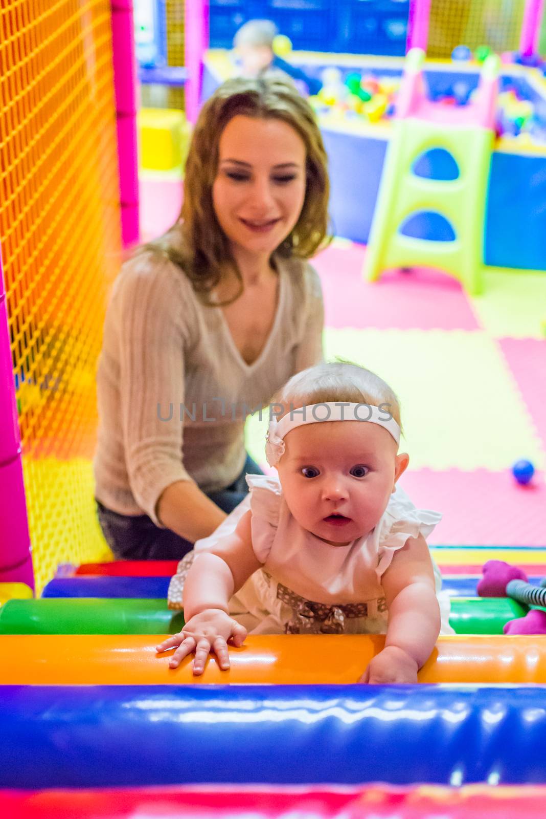 mother and child play in the children's room