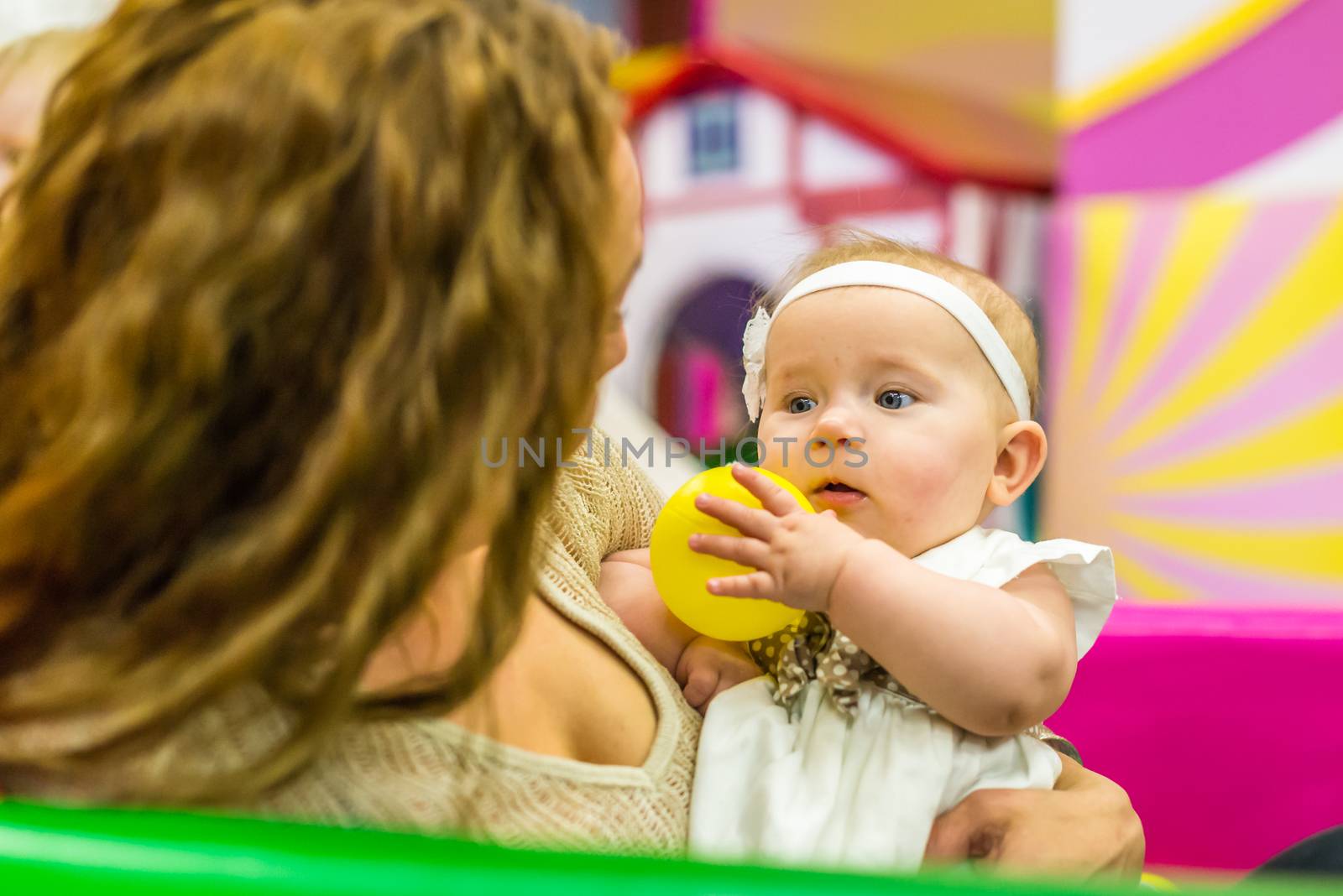 mother and child play in the children's room