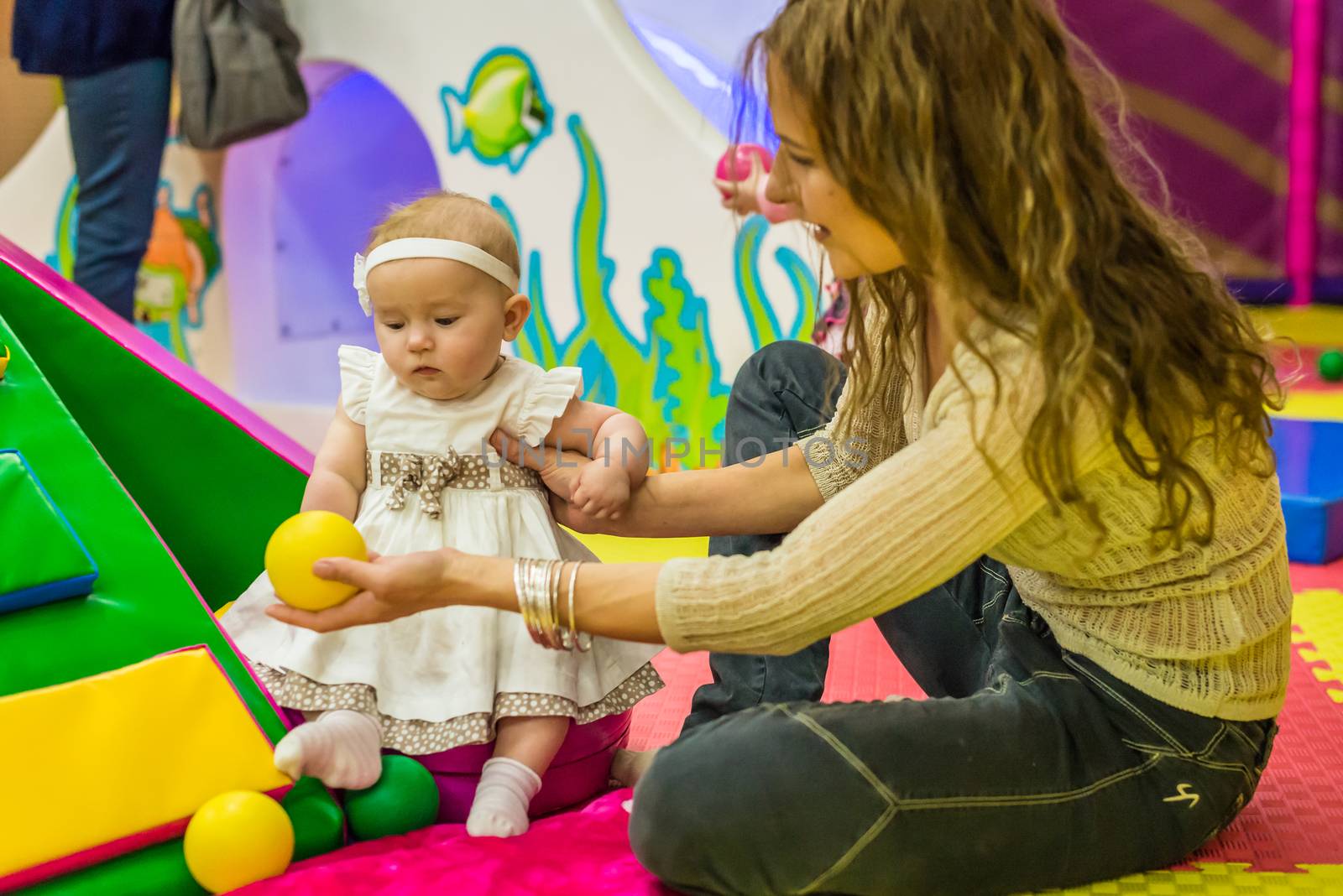 mother and child play in the children's room