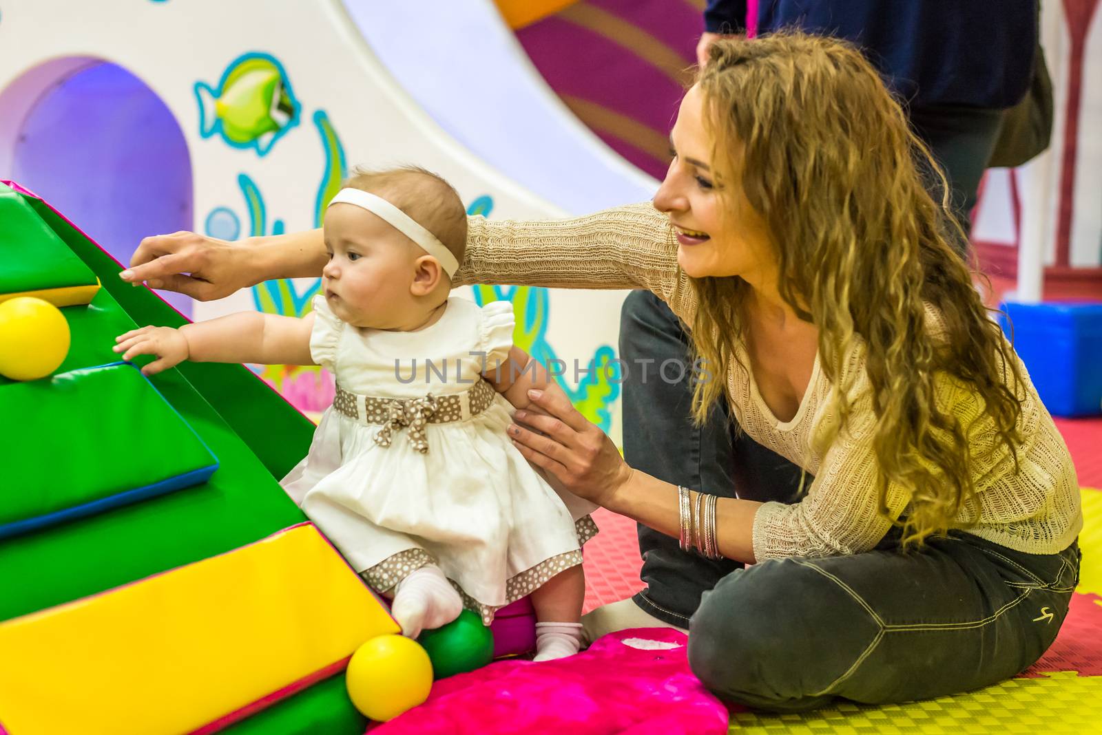 mother and child play in the children's room