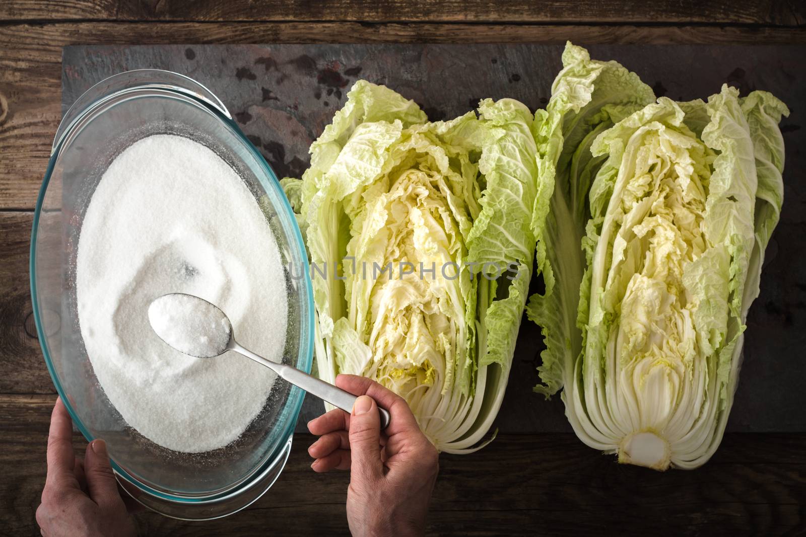 Salt, the two halves of Chinese cabbage to cook kimchi on slate horizontal