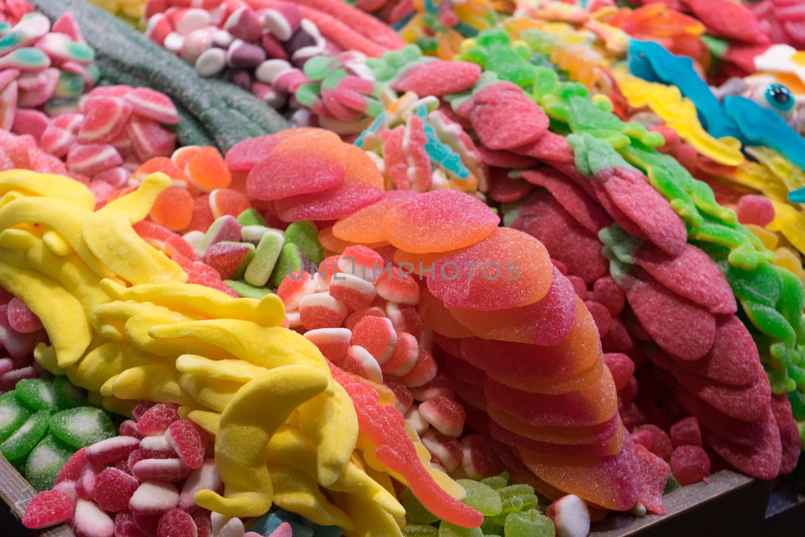 Selection of colourful candy on display at a stall in the mercado de la Boqueria, Barcelona, Spain