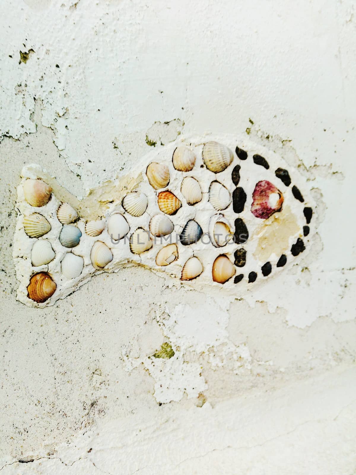 Closeup of a wall decoration on a wall on the beach