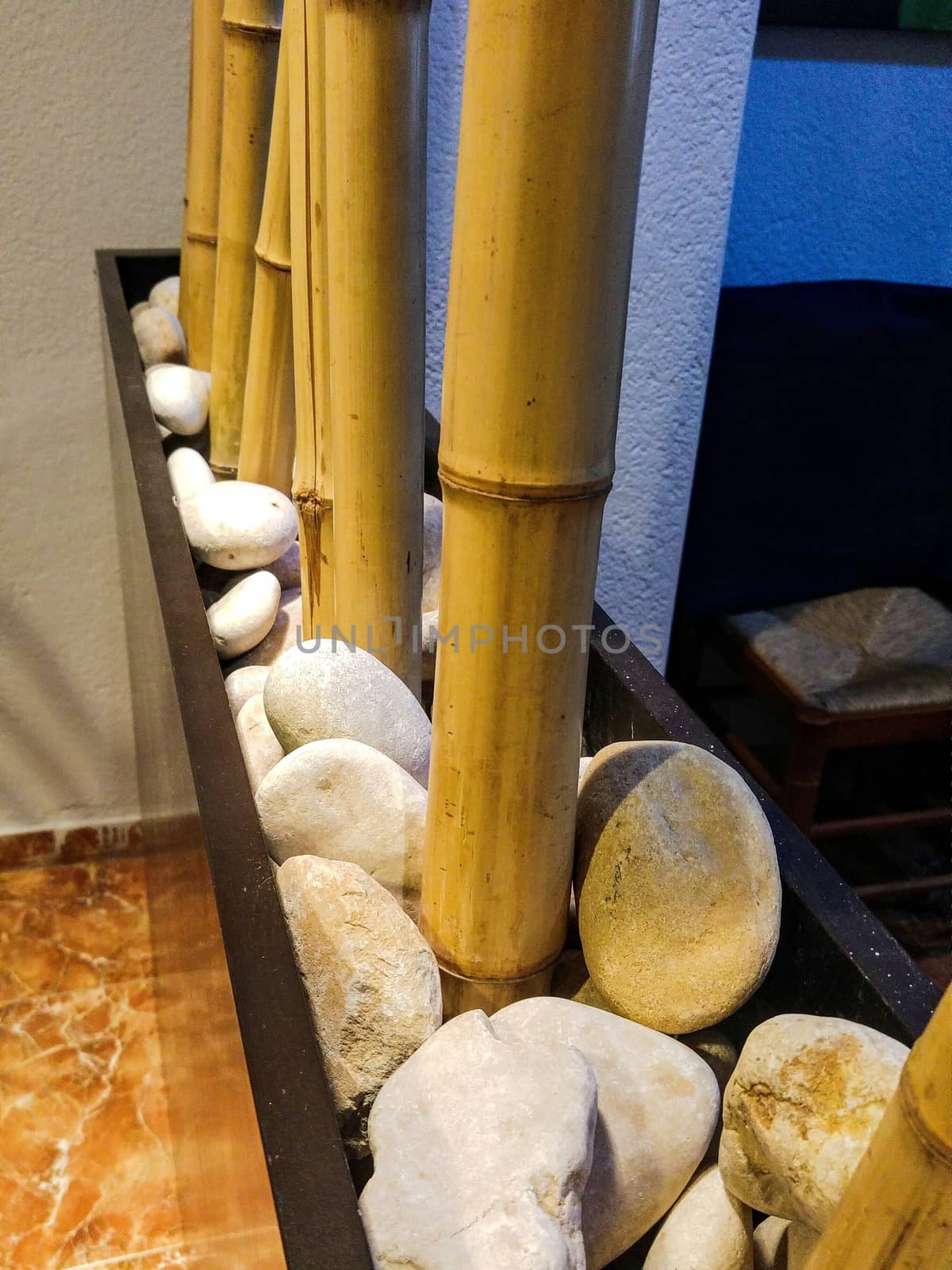 Decoration in a restaurant with stones and canes