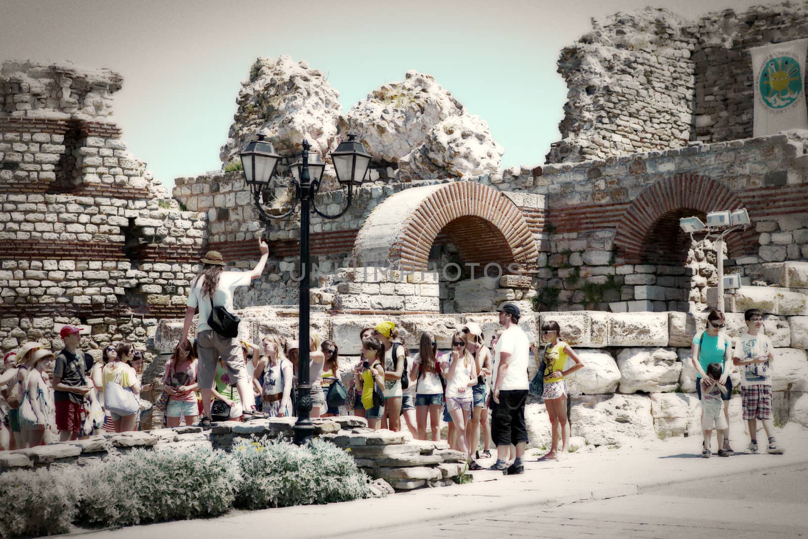 Nesebar, Bulgaria - August 29: People visit Old Town on August 29, 2014 in Nesebar, Bulgaria. Nesebar in 1956 was declared as museum city, archaeological and architectural reservation by UNESCO.