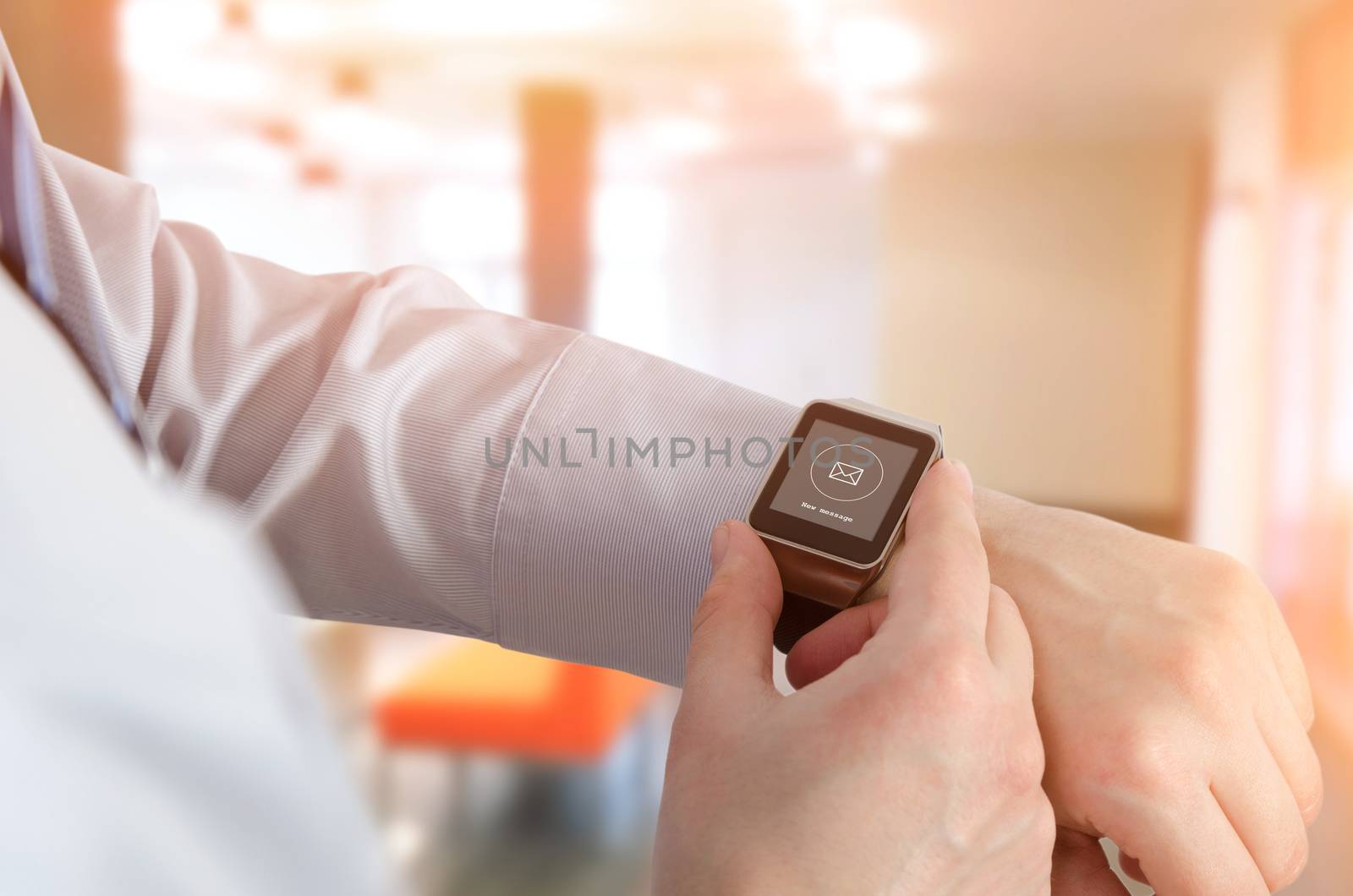 Man using smartwatch with e-mail notifier by simpson33