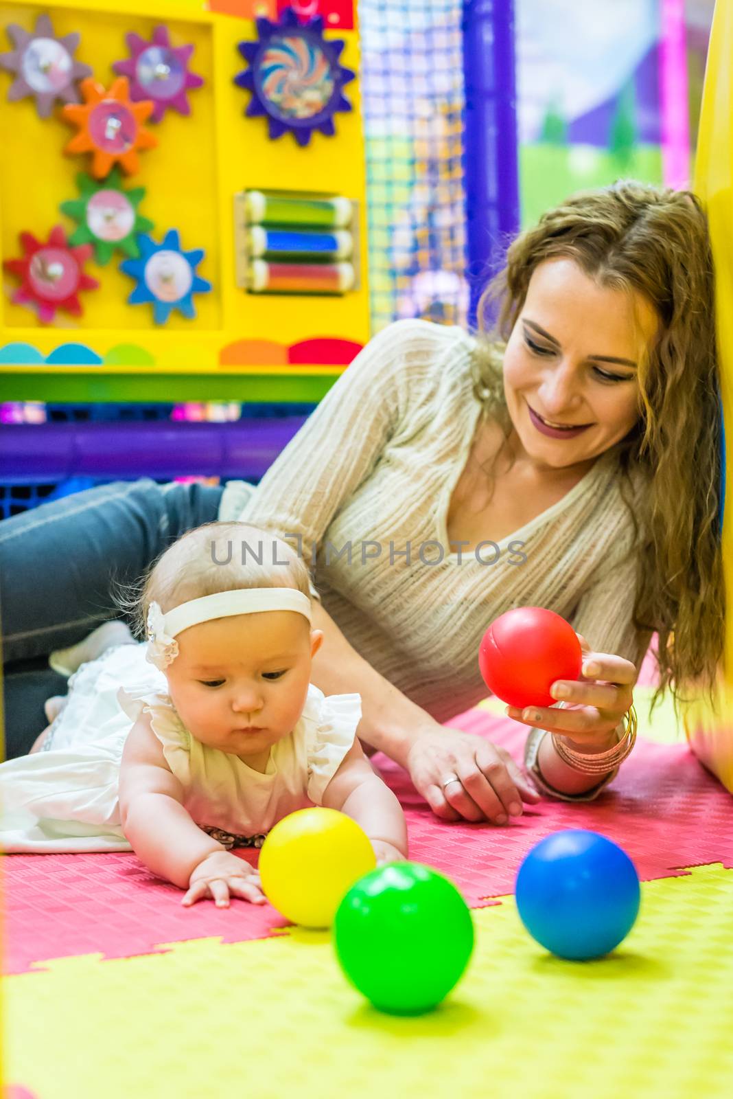 mother and child play in the children's room