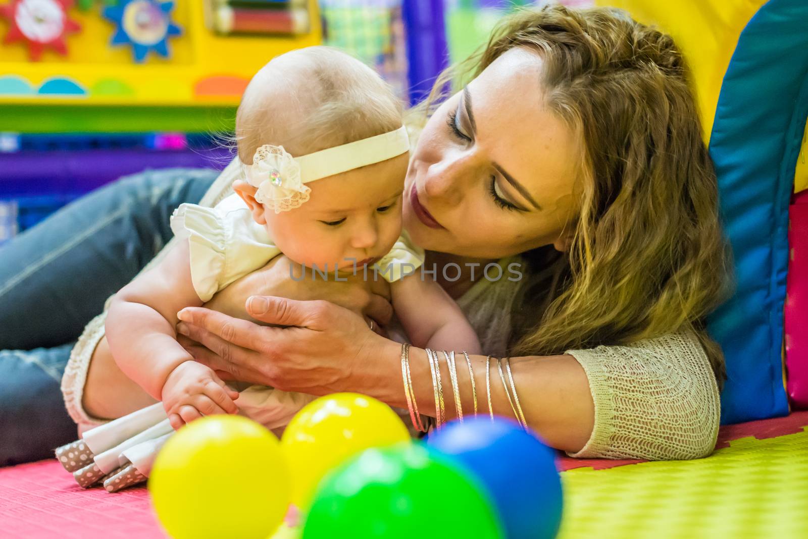 mother and child play in the children's room