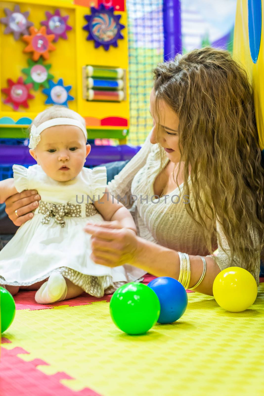 mother and child play in the children's room