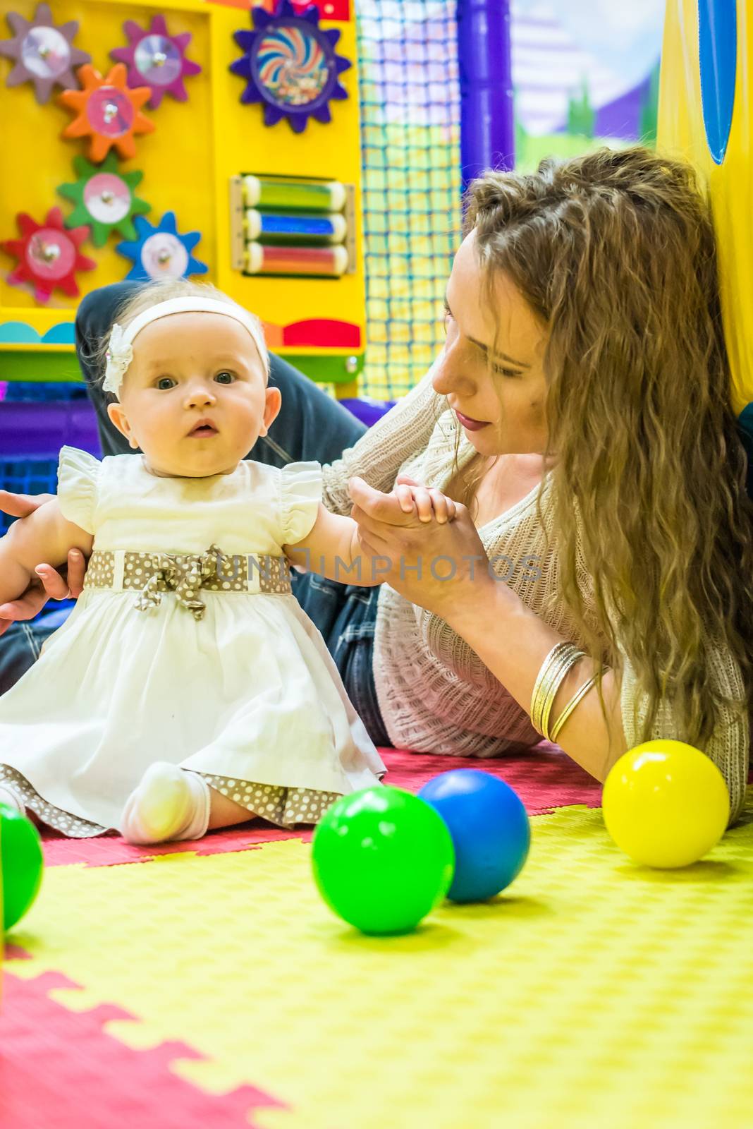 mother and child play in the children's room