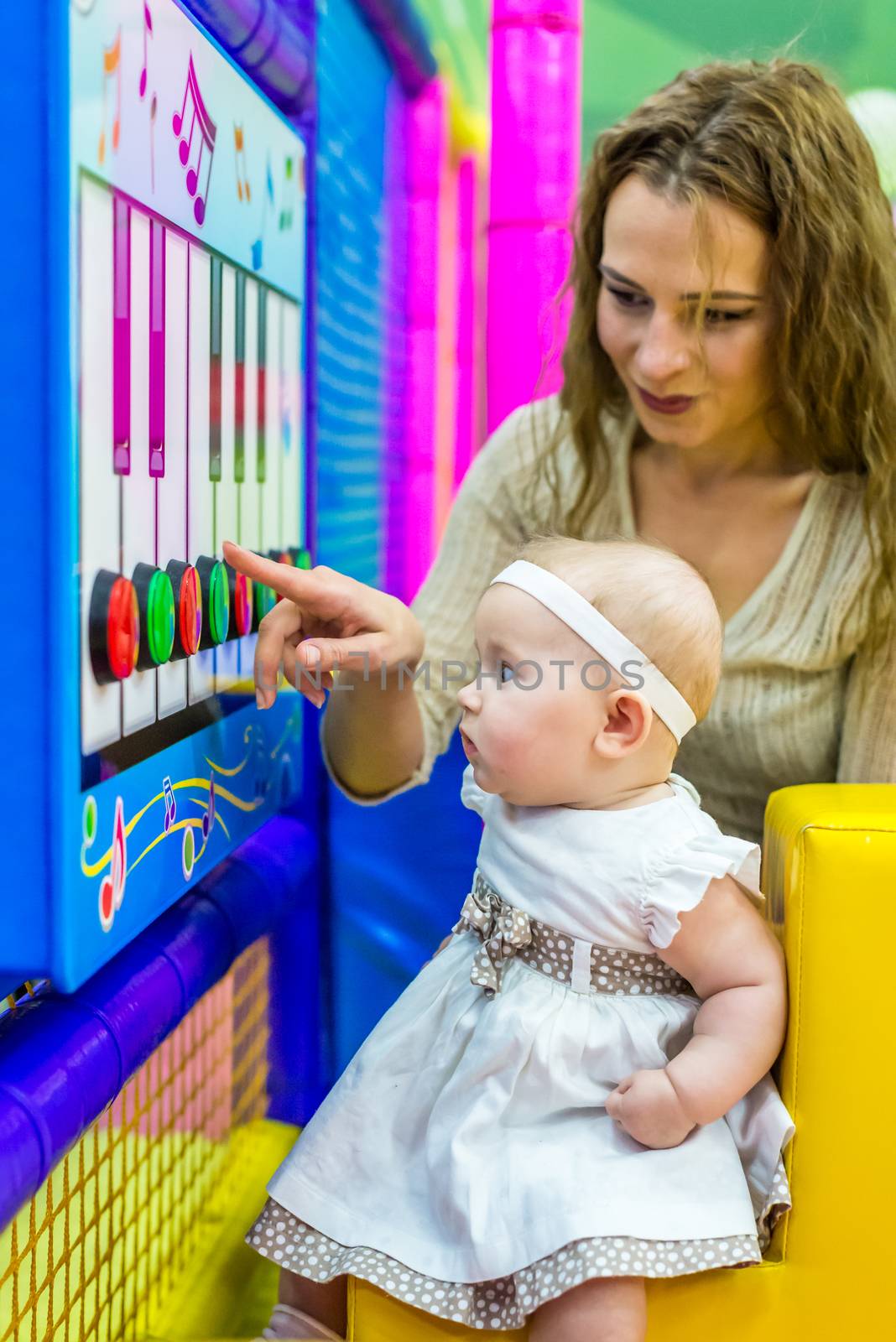 mother and child play in the children's room