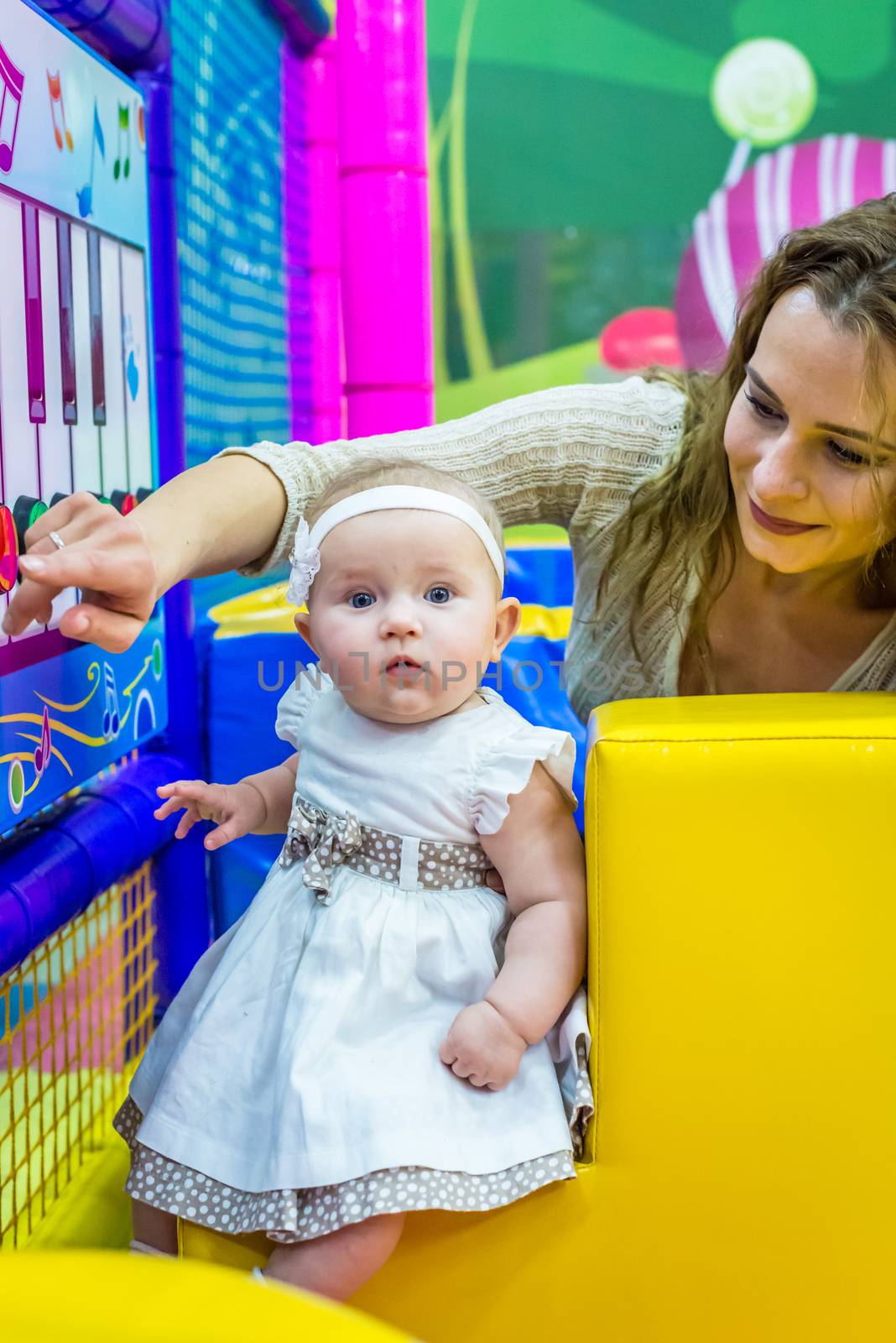 mother and child play in the children's room