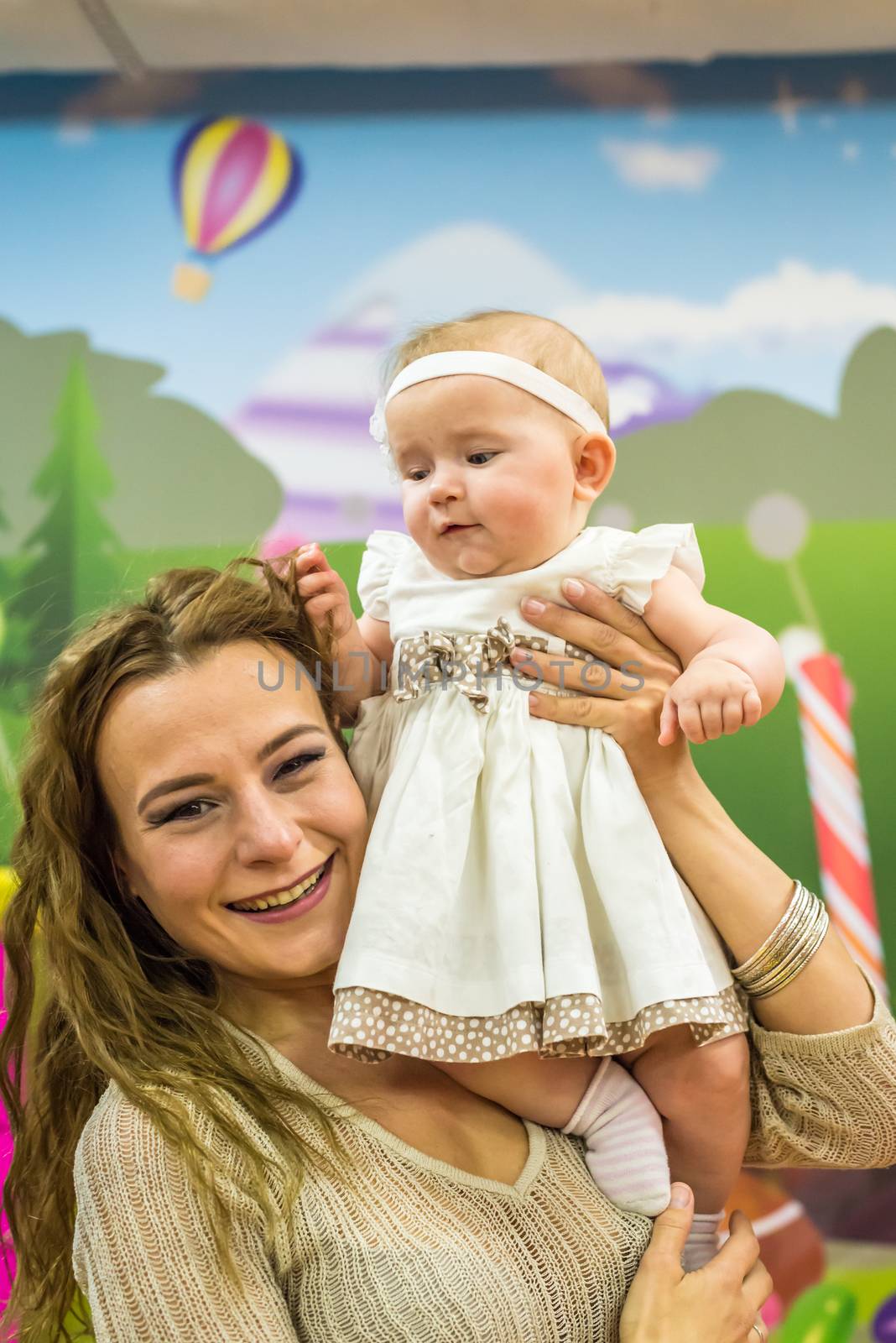 mother and child play in the children's room