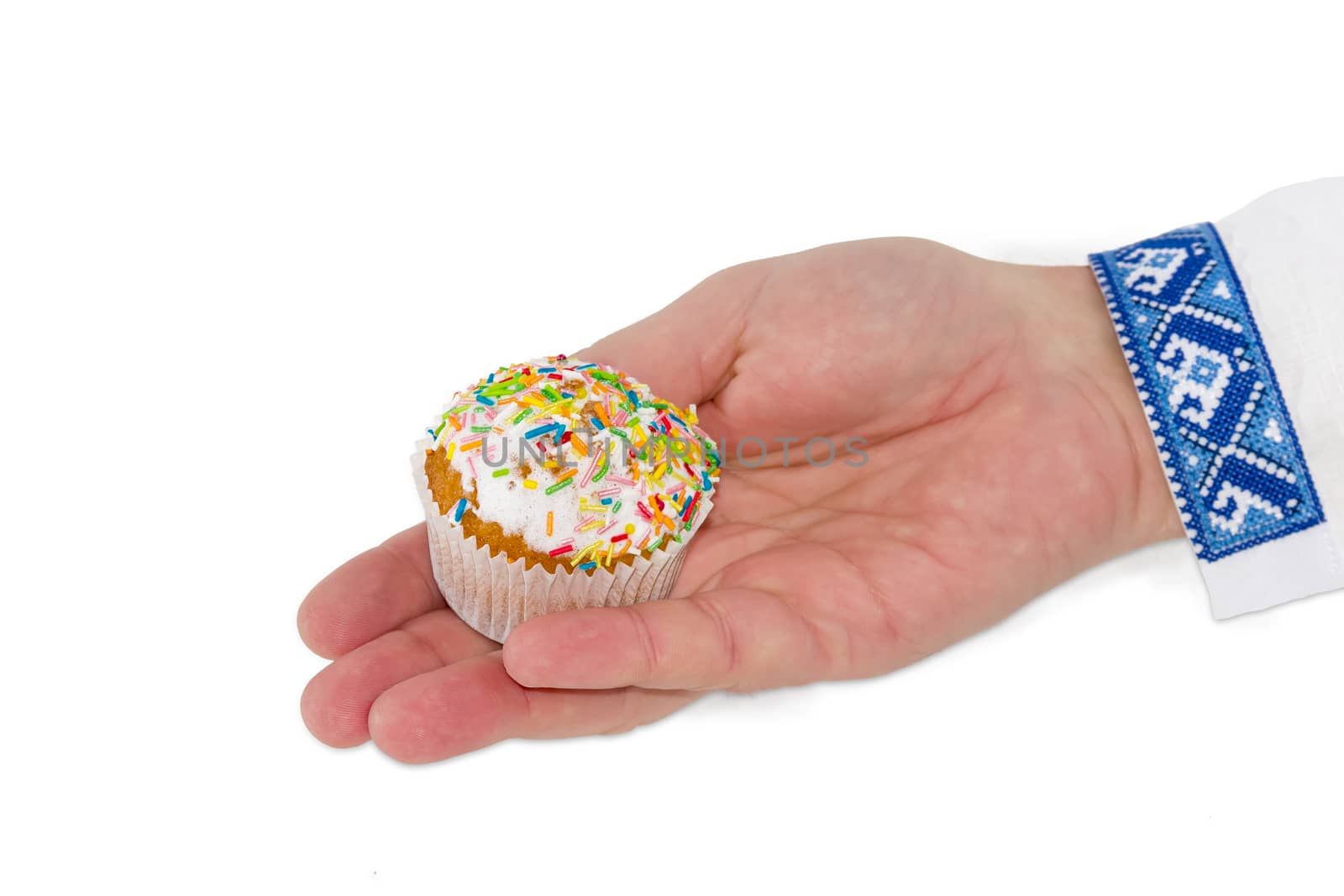 Little Easter cake in male hand on a light background by anmbph