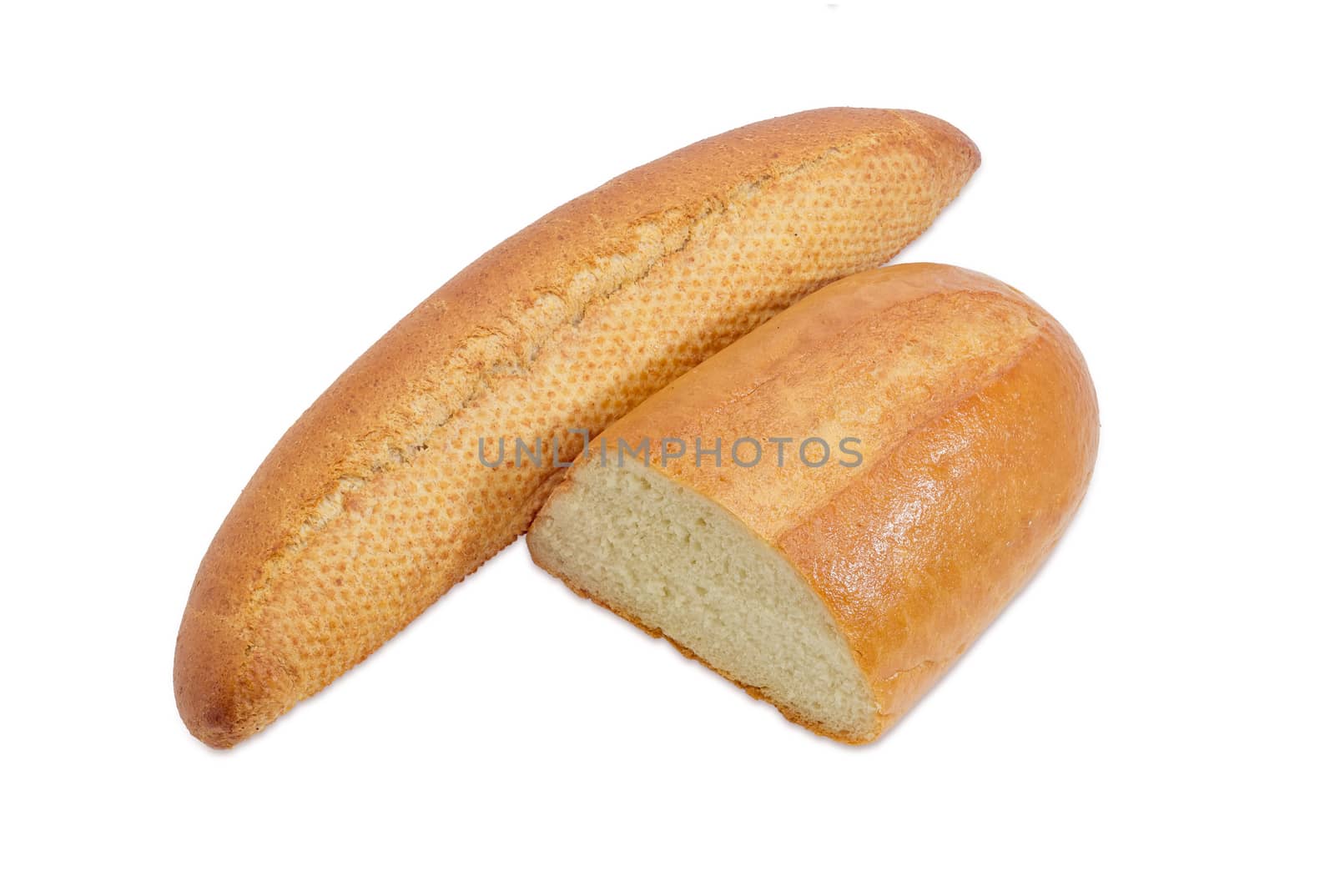 Whole long roll of bread with bran and half of a loaf wheat bread on a light background
