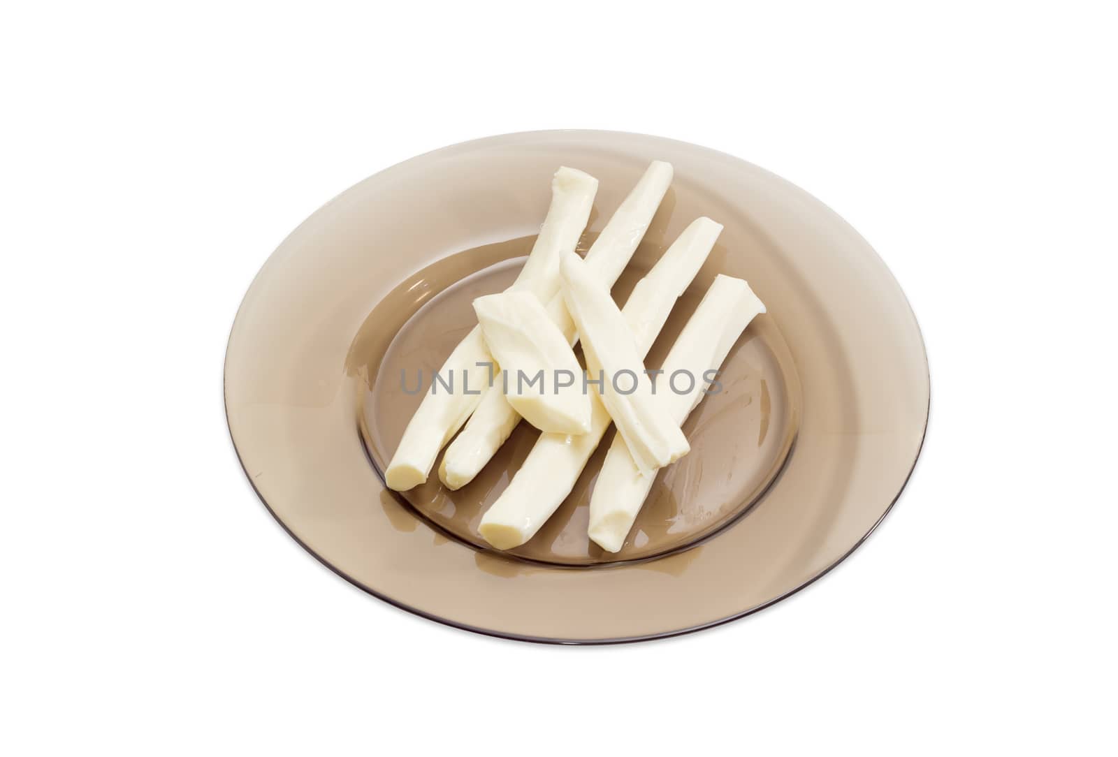 Sticks of a chechil cheese on a glass dish by anmbph