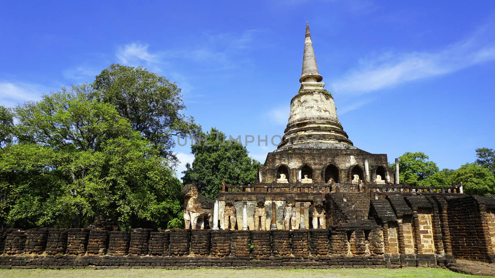 Historical Park Wat chang lom temple pagoda with fence in Sukhothai world heritage