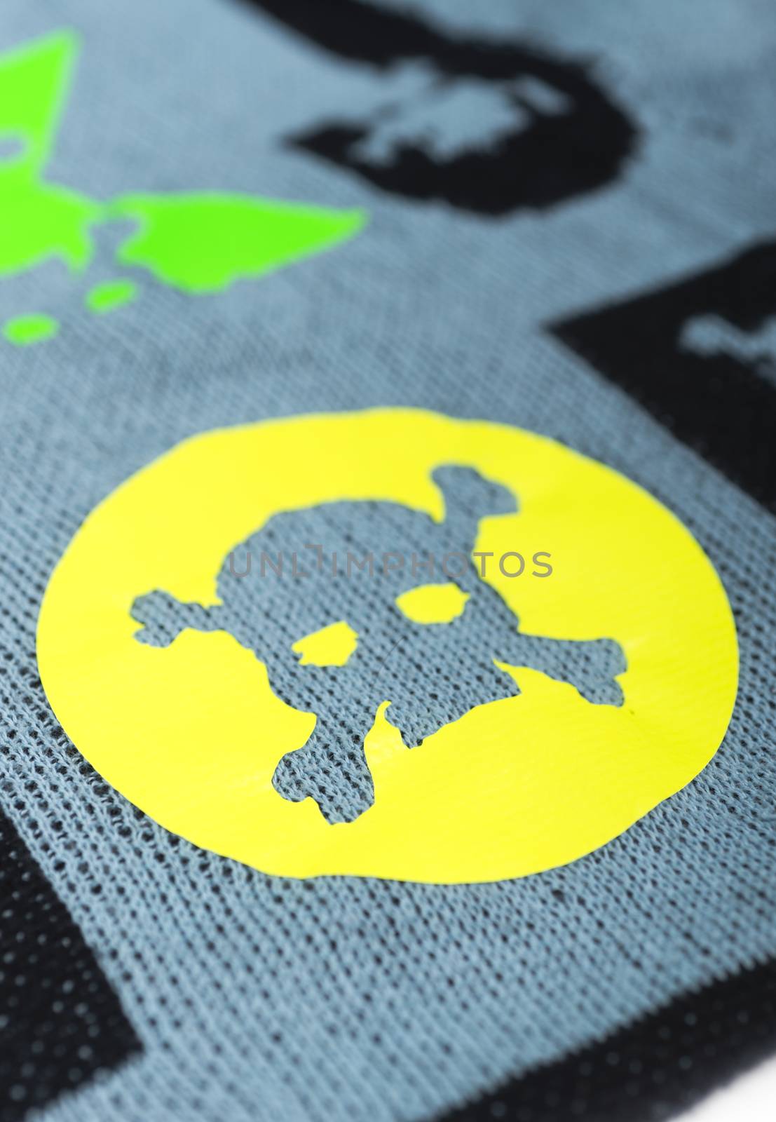 Fabric with skulls and bones .