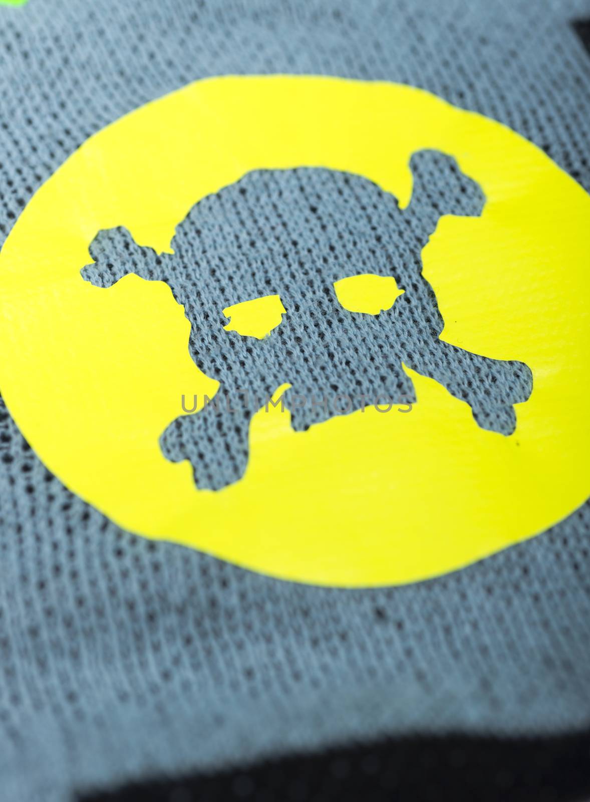 Fabric with skulls and bones .