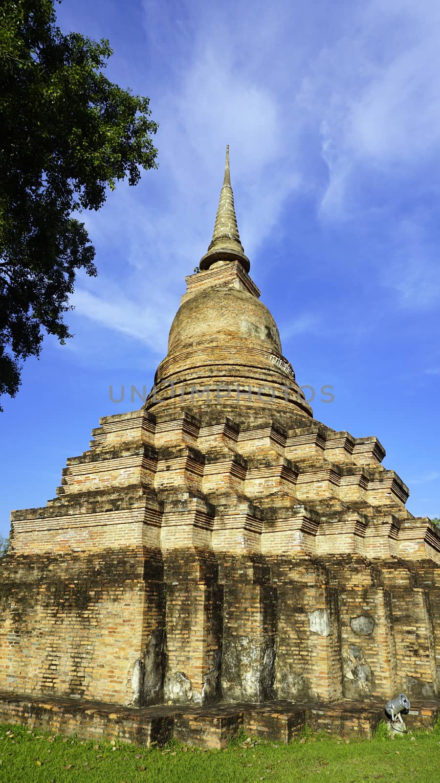 Historical Park Wat Mahathat temple pagoda vertical in Sukhothai world heritage