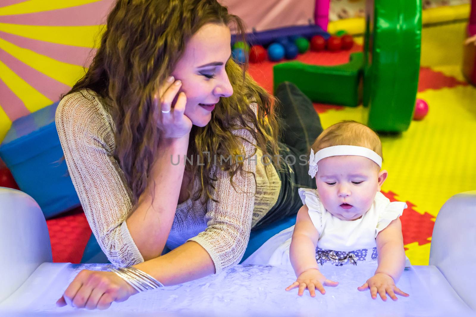 mother and child play in the children's room