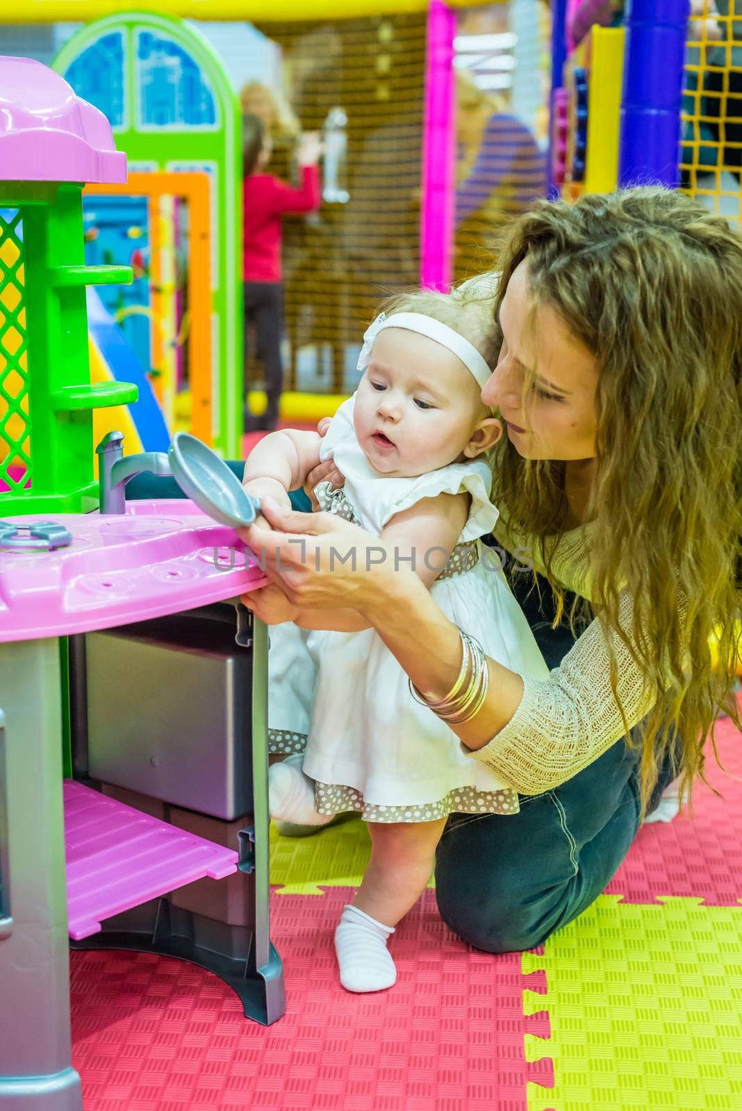 mother and child play in the children's room