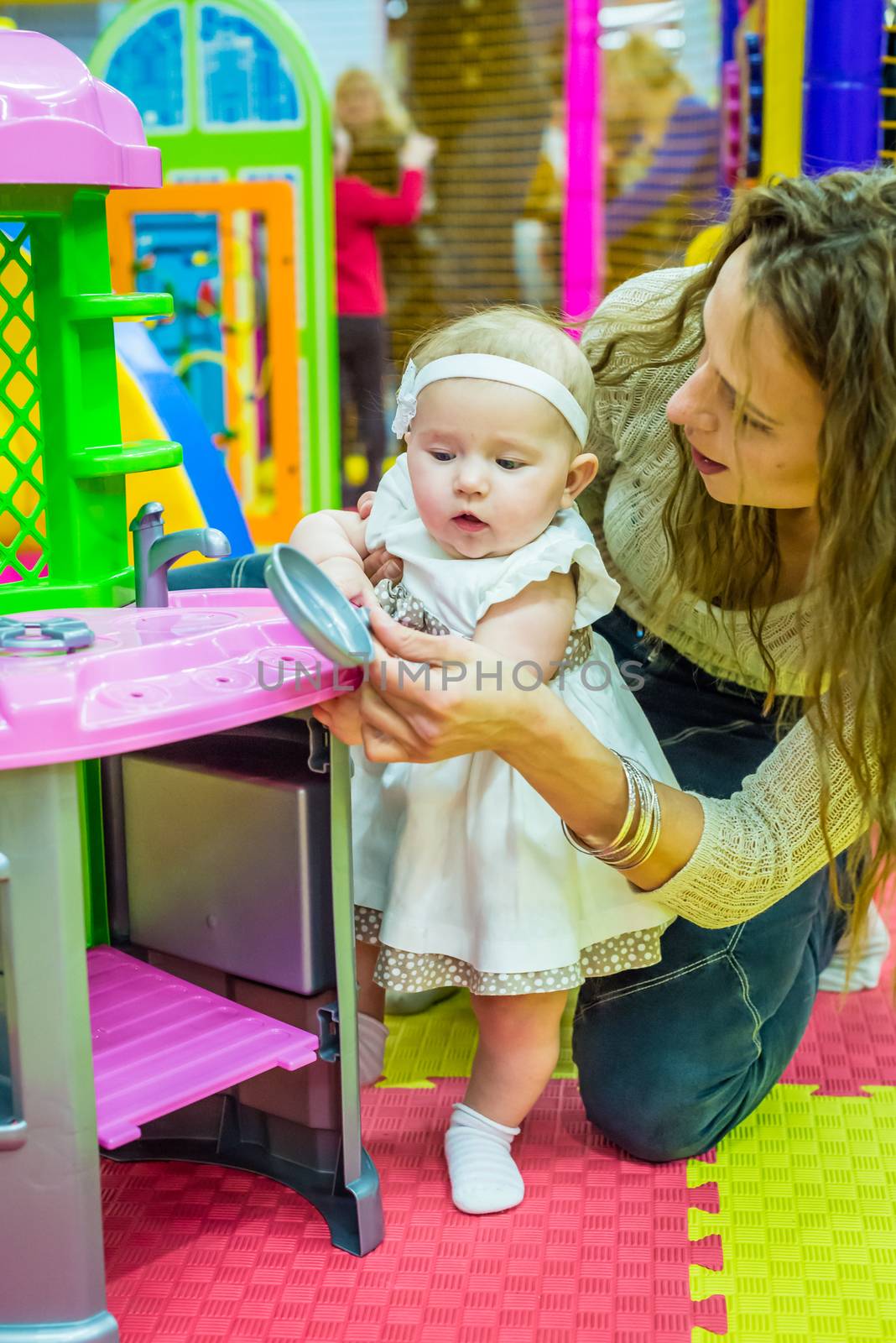 mother and child play in the children's room