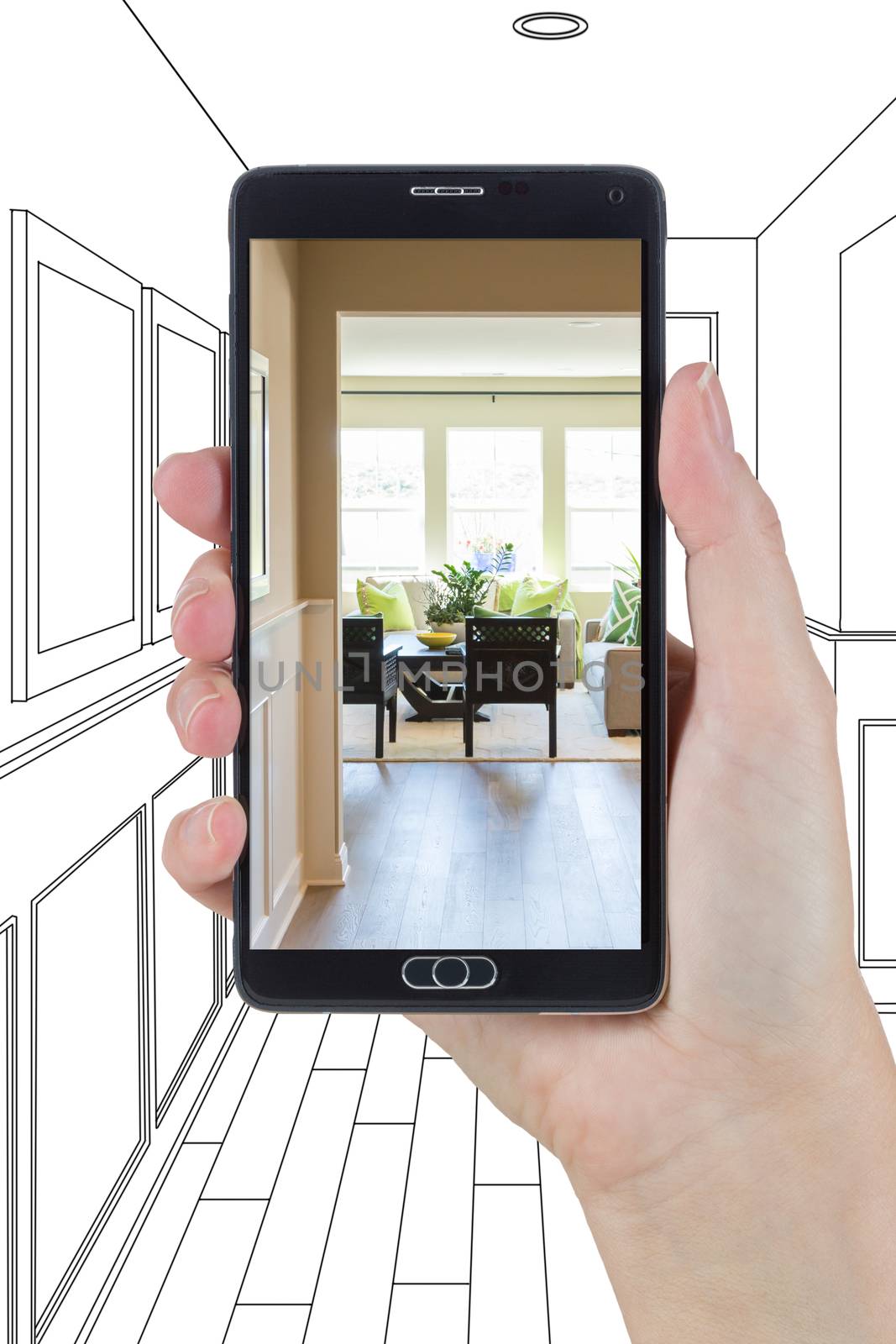Hand Holding Smart Phone Displaying Photo of the House Hallway Drawing Behind.