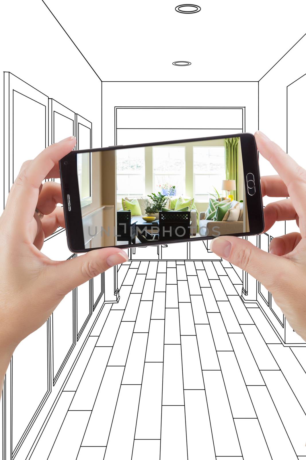 Hand Holding Smart Phone Displaying Photo of the House Hallway Drawing Behind.