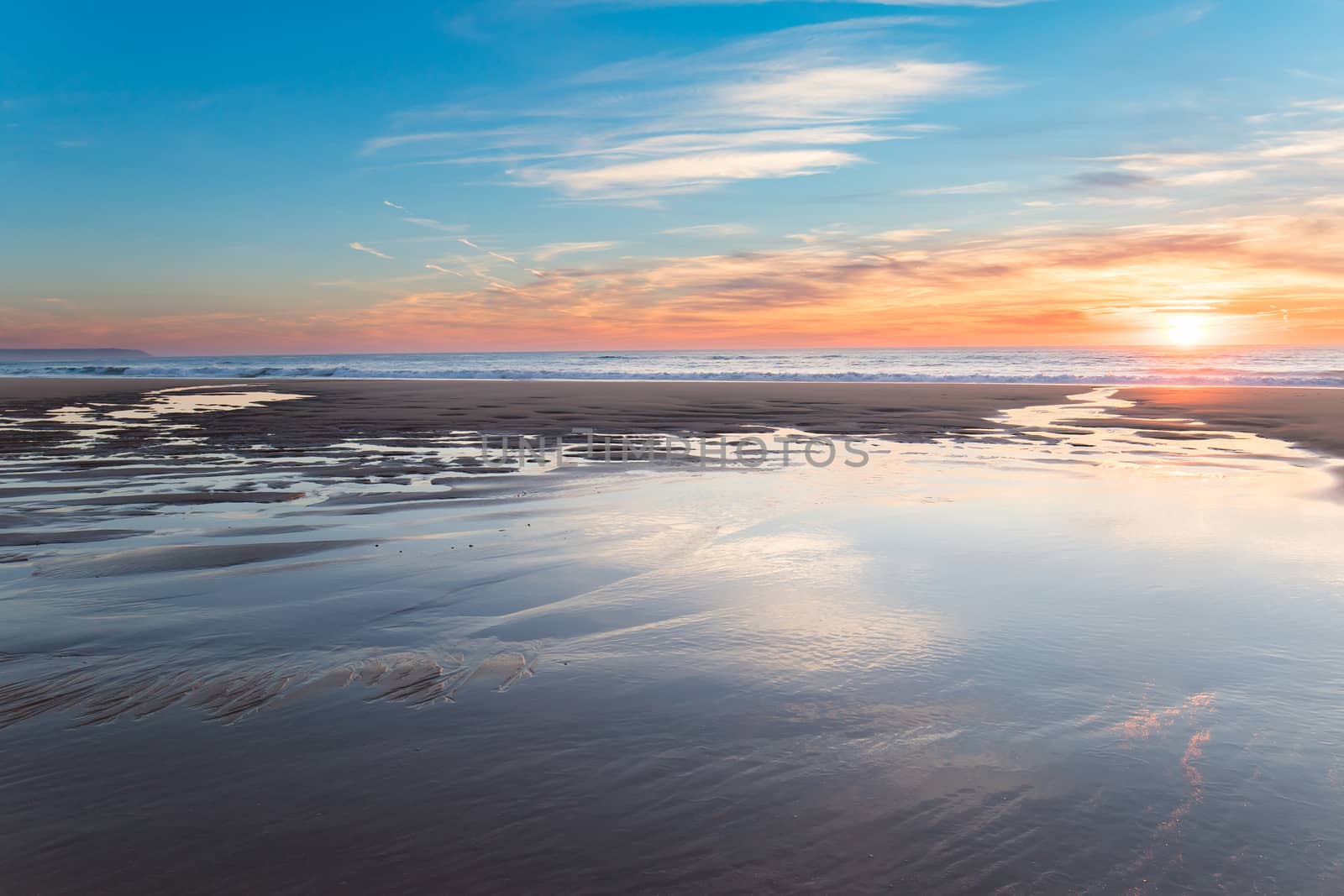 Beautiful sunset at the beach in a warm winter evening. 