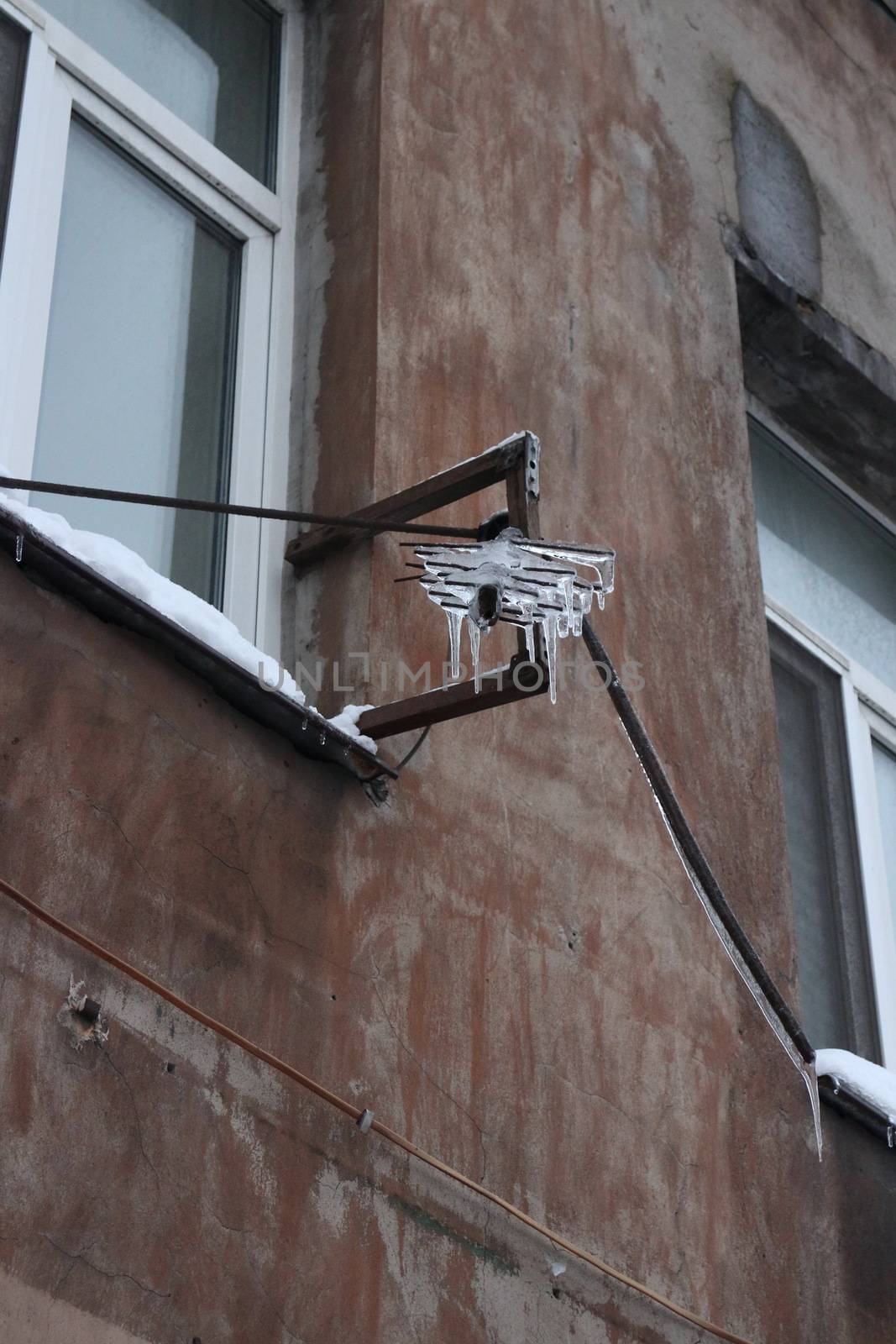 Antenna covered by ice after the winter thaw